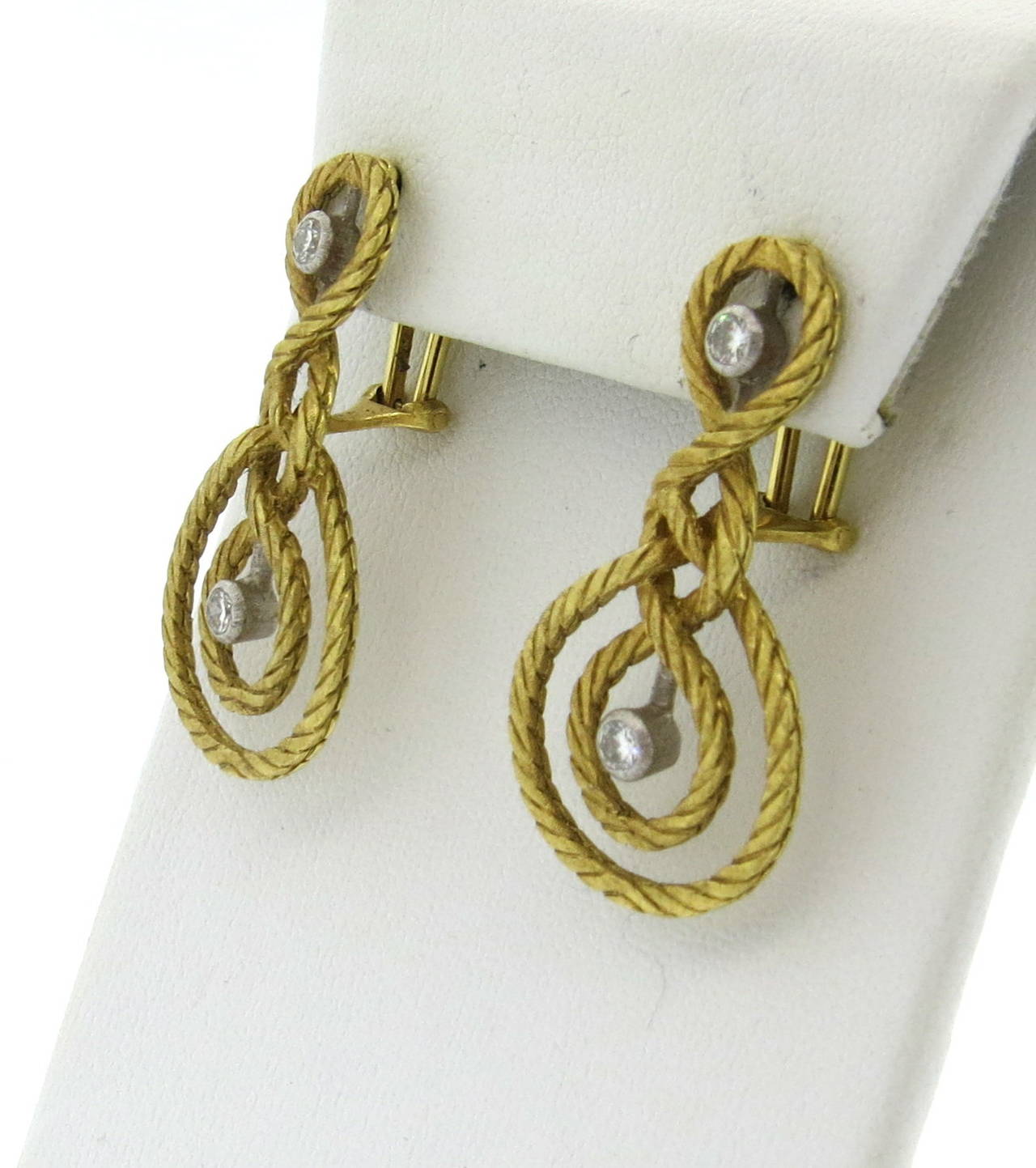 18k gold earrings by Buccellati with diamonds, measuring 37mm x 20mm. Marked Buccellati,750. weight - 13.5 grams