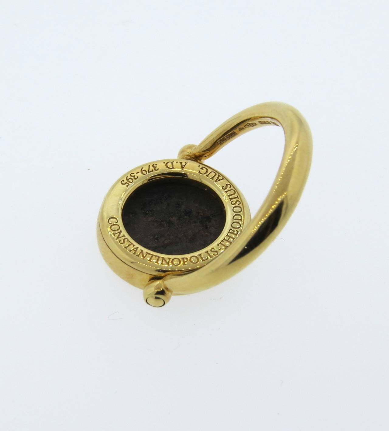 Bulgari 18k gold ring from Monete collection, featuring 12mm ancient coin with flip ring top . Ring size 6, ring top is 16mm in diameter. Marked Bvlgari, 750, made in Italy. weight - 9.8 grams
Comes in Bulgari box