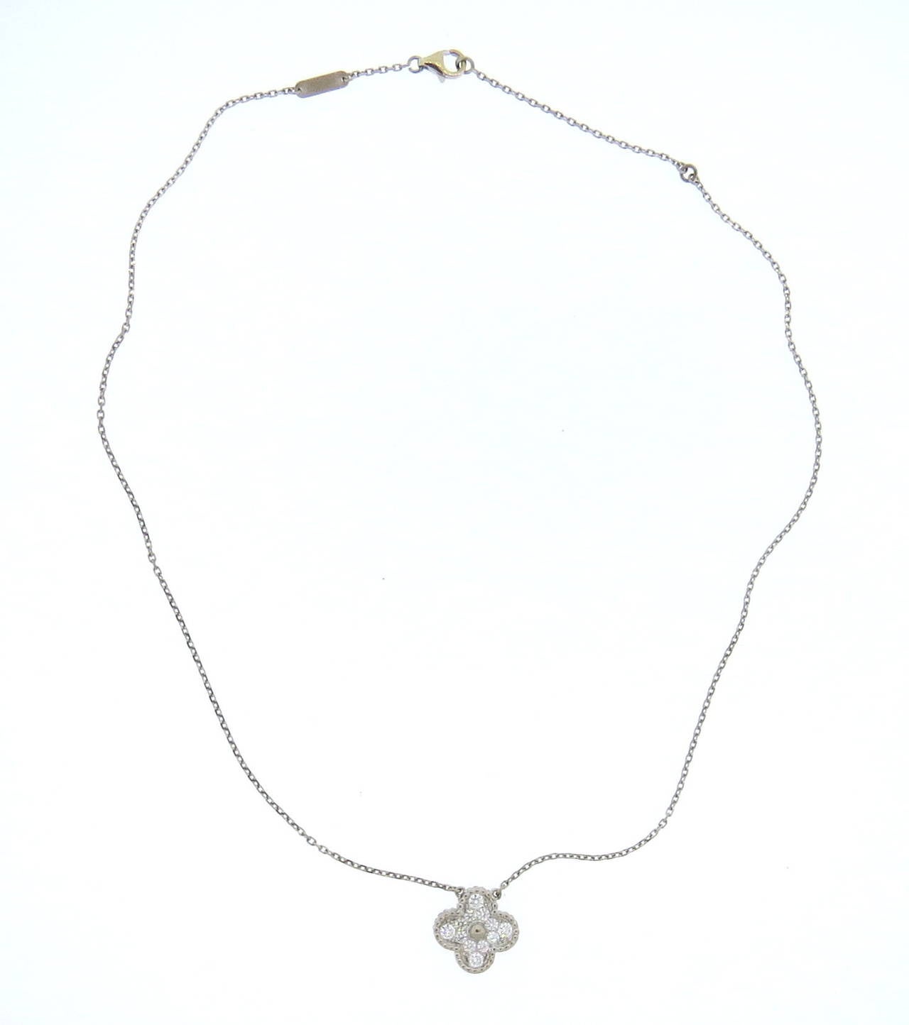 Van Cleef Arpels 18k white gold necklace with signature Vintage Alhambra pendant, set with diamonds. Necklace is 17