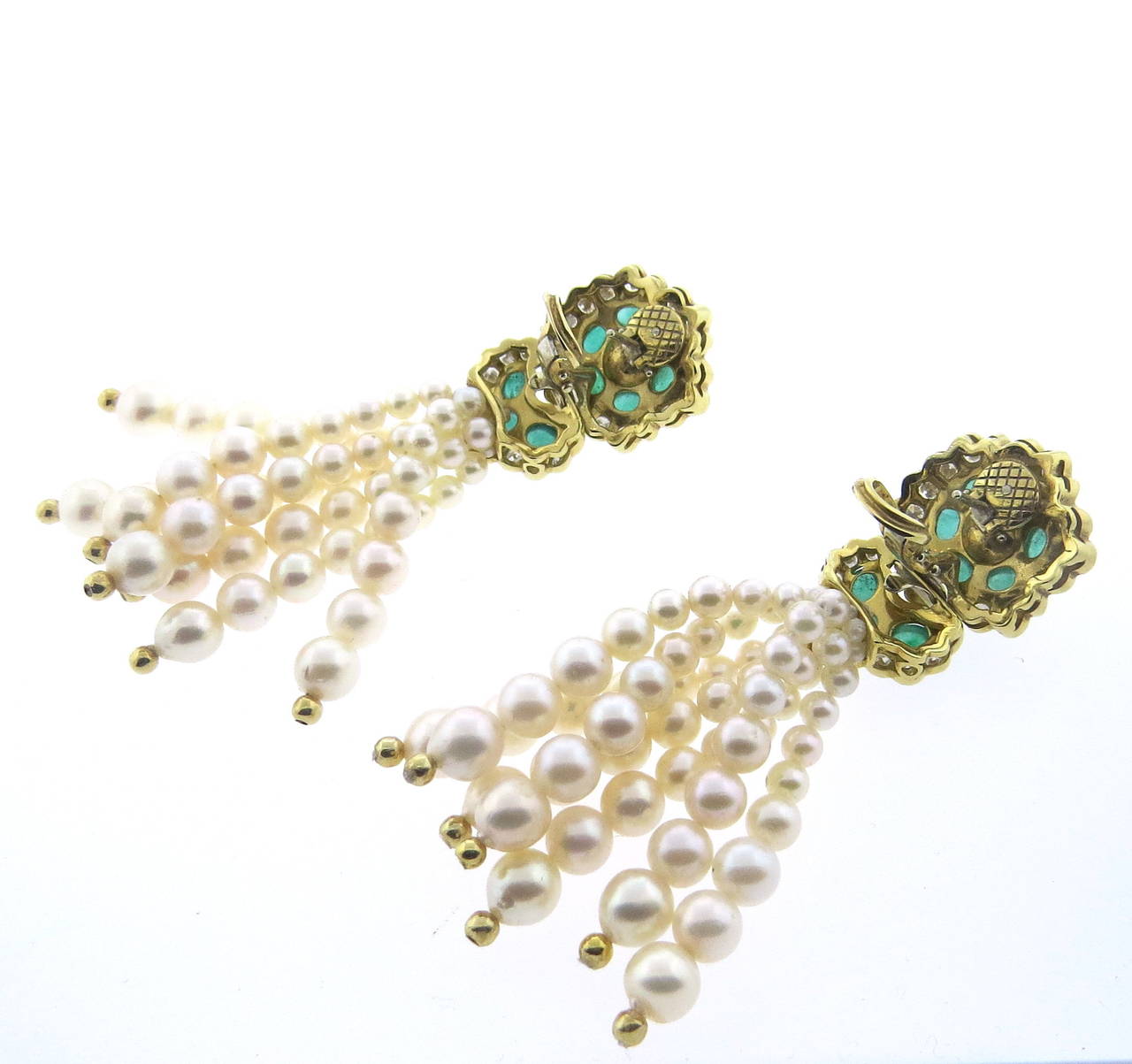 Beautiful 18k gold earrings with emerald cabochon diamond top and  graduated pearls tassel drops. Approx. 3.60ctw diamonds and 5.00ctw eameralds.Earrings measure 76mm x 22mm,. Weight - 62.1 grams