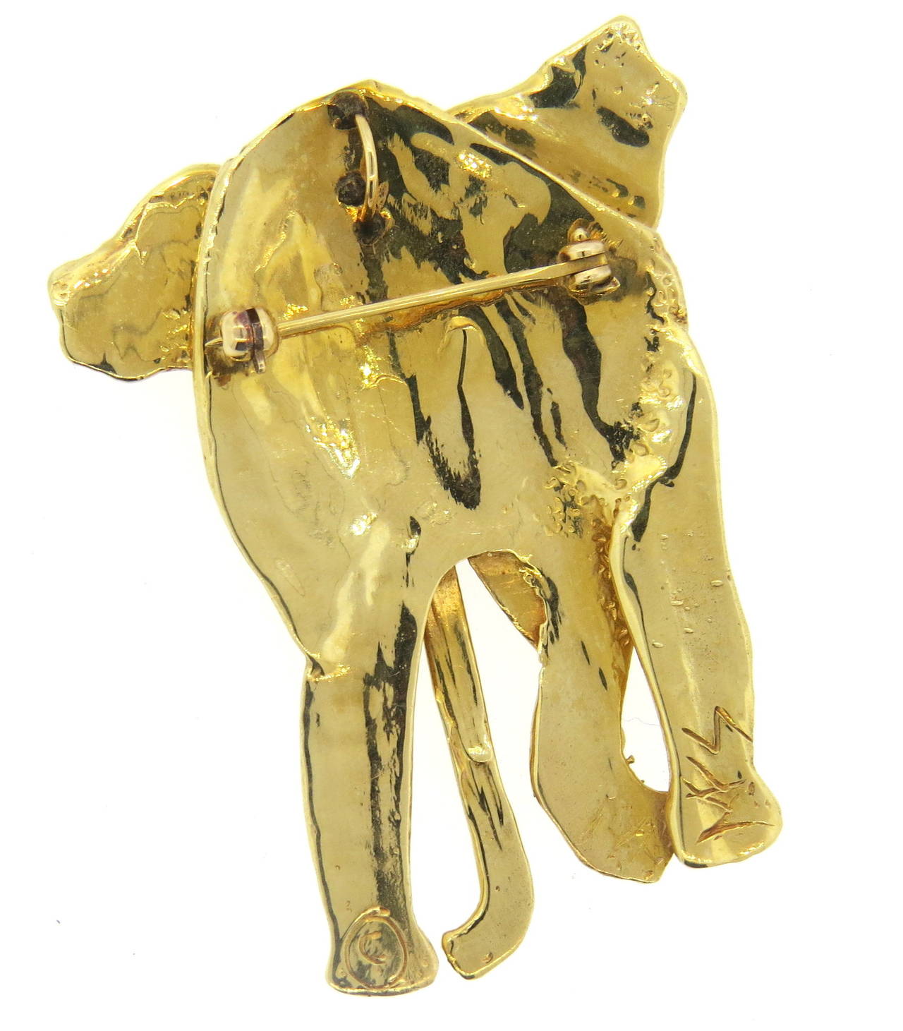 Unusual 14k gold elephant brooch pendant, with sapphire eyes by Mia Fonssagrives-Solow. Brooch is 54mm x 43mm. Marked MFS,14k. weight - 34.5 grams