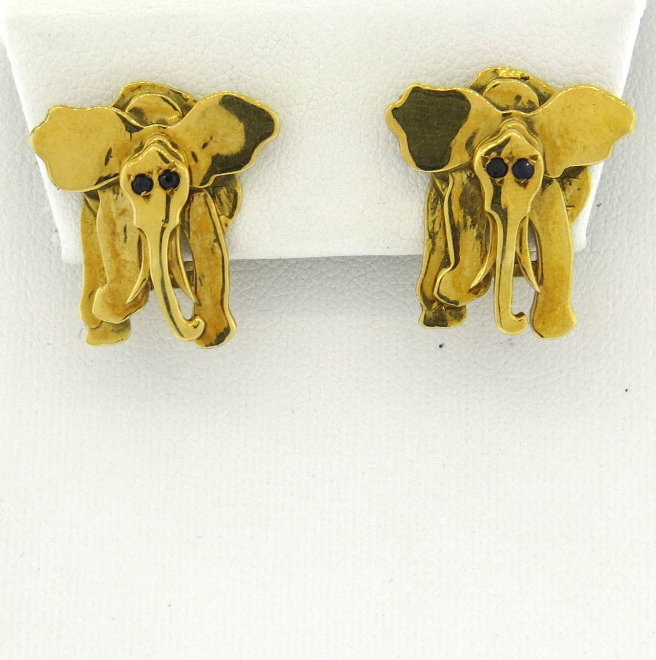 14k gold elephant earrings with sapphire eyes, by Mia Fonssagrives-Solow, measuring 21mm x 20mm. Marked MFS and 14k. weight - 13.1 grams