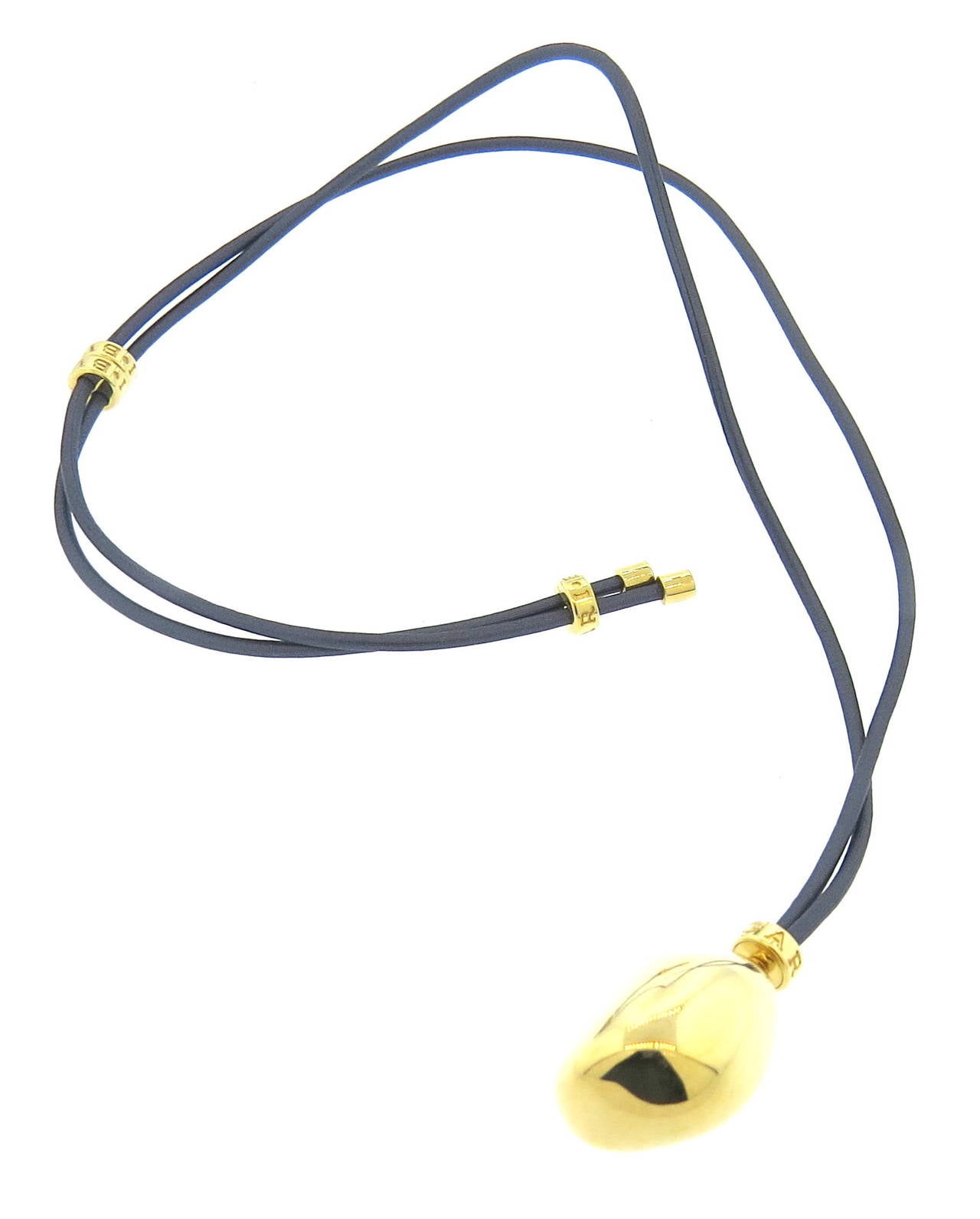 18k gold pendant on a cord by Bulgari from Sassi collection Cord is adjustable up to 28