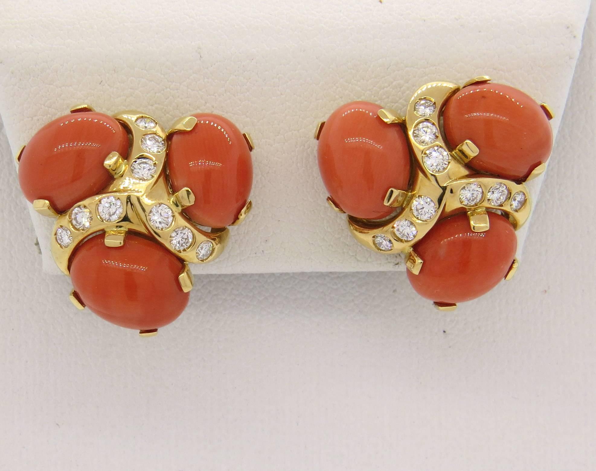 Pair of 18k yellow gold earrings, crafted by Verdura, decorated with coral cabochons and approximately 0.78ctw in FG/VVS diamonds. Earrings measure 21mm x 21mm. Marked: Verdura, VEC7652, 750, 2161MI. Weight - 17.5 grams
Earrings come in Verdura