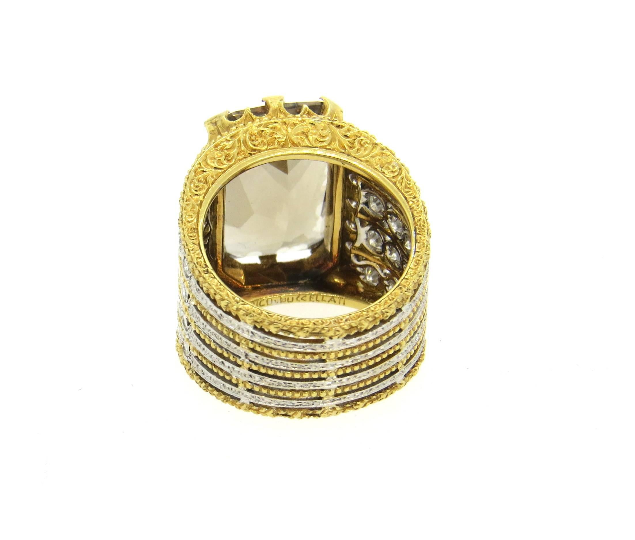 18k yellow and white gold impressive ring, crafted by Buccellati, decorated with an approx. 16ct smokey topaz as a centerpiece, surrounded with 1.46ctw in G/VS diamonds. Ring is a size 6 3/4, top of the ring is 18mm wide, featuring engraved sides.