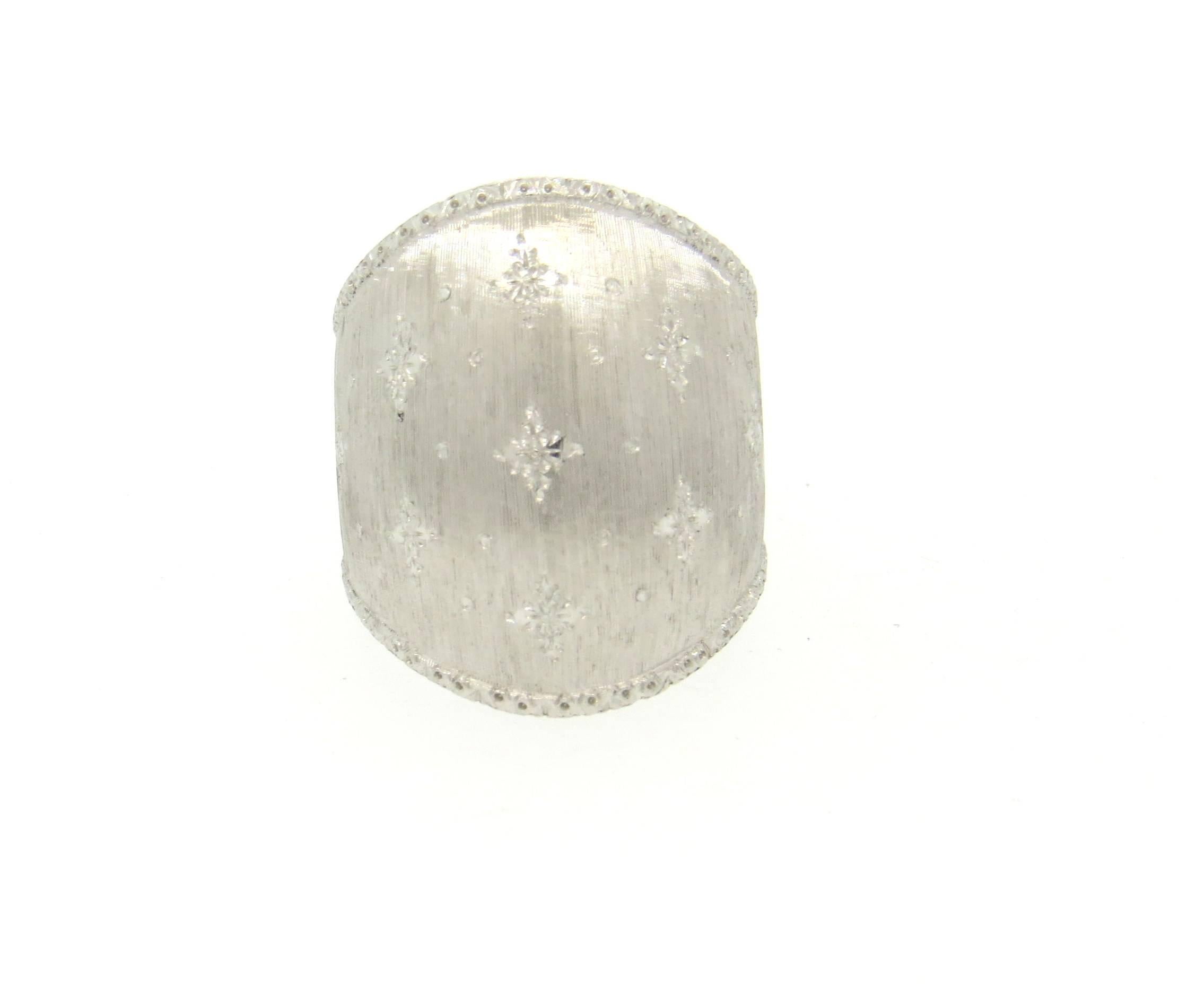 Large 18k white gold dome ring, crafted by Buccellati. Ring is a size 6 3/4, ring top is 26mm wide. Marked: Italy, 750, M. Buccellati. Weight of the piece - 11.9 