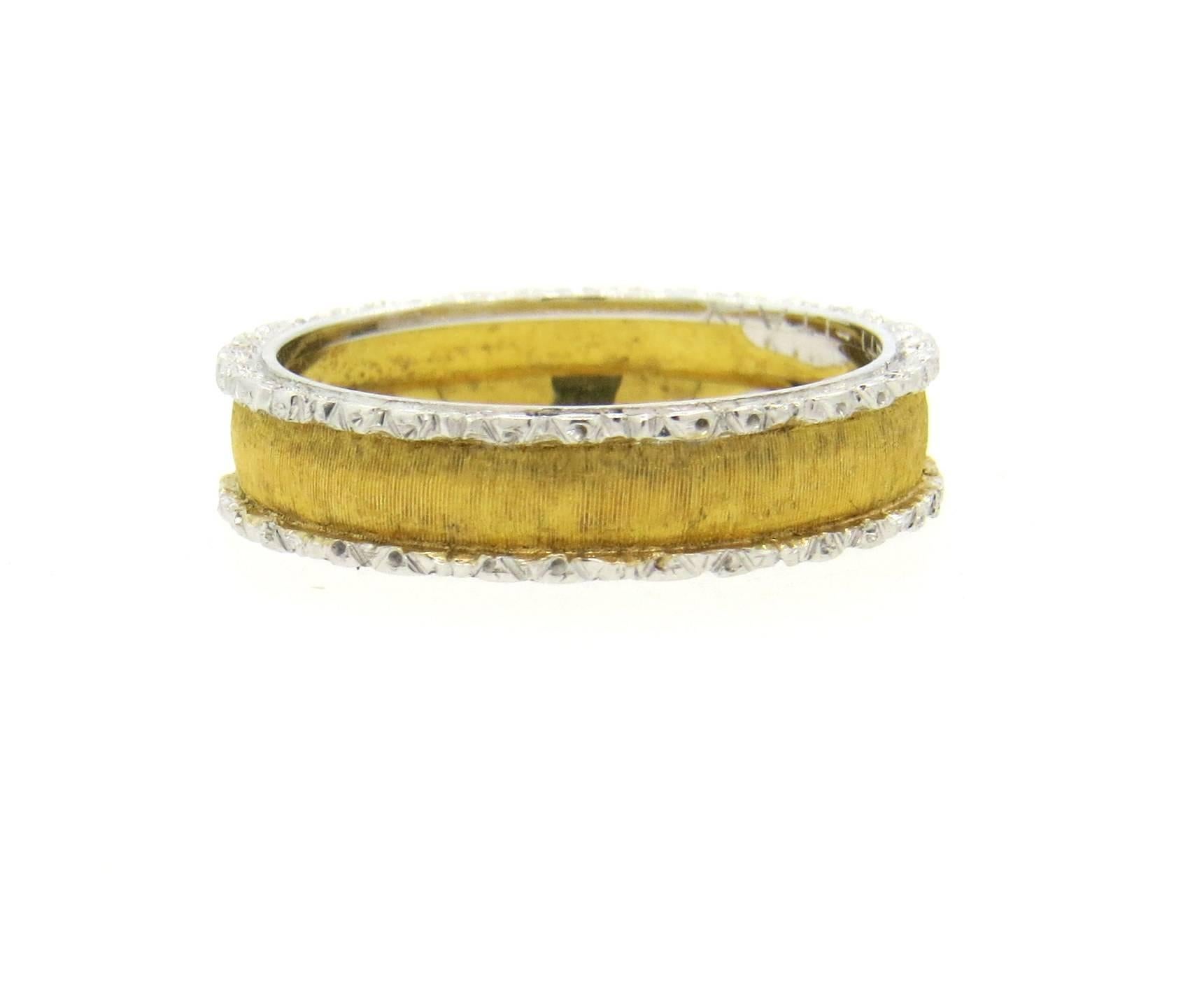 Classic 18k yellow and white gold wedding band ring, crafted by Buccellati. Ring is a size 7 and is 4.5mm wide. Marked: M.Buccellati, Italy, 750. Weight of the piece - 3.4 grams
