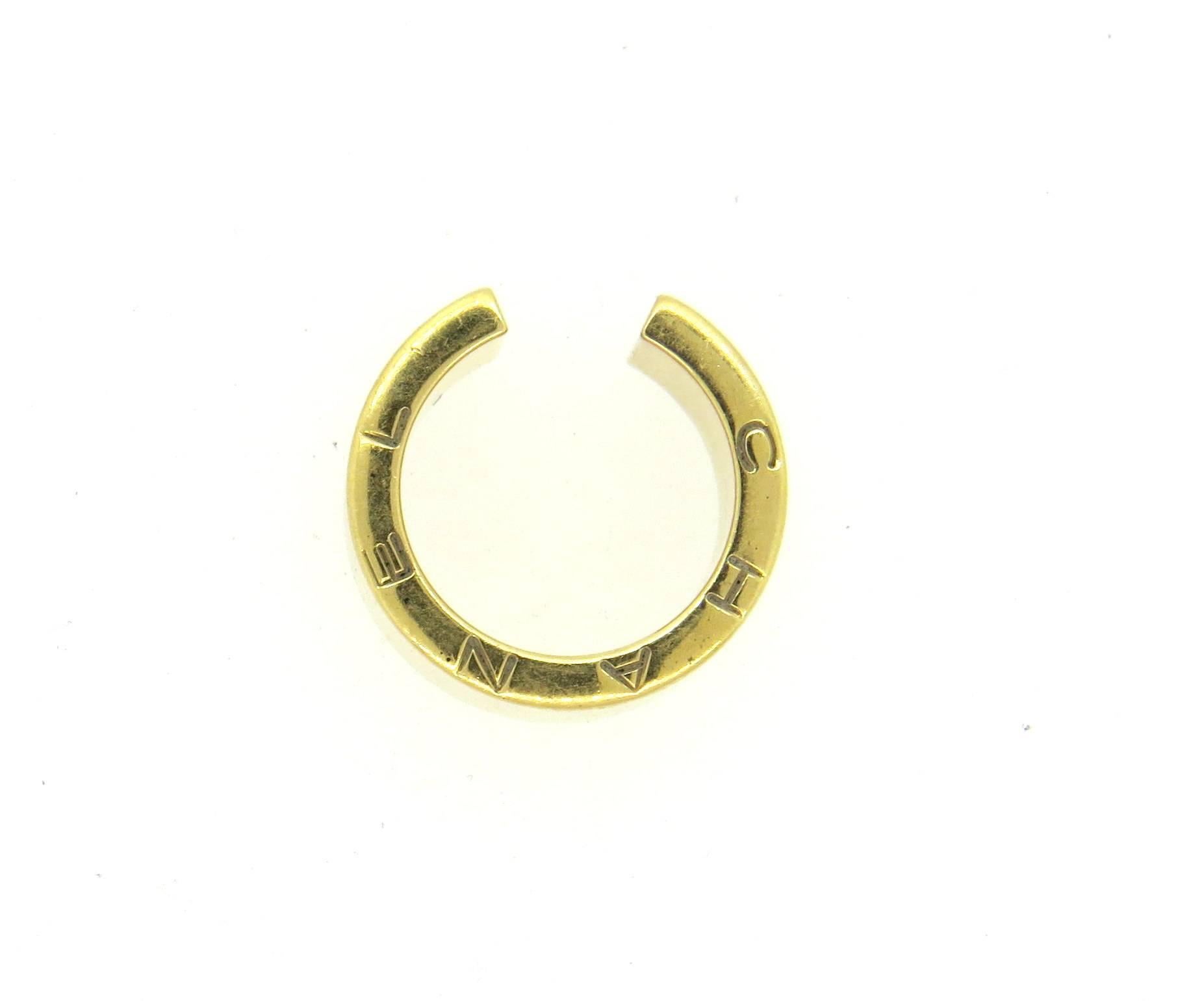 18k yellow gold cuff ring, crafted by Chanel. Ring is a size 4 and is 11mm wide. Marked: Chanel, 750, French gold assay marks, 9G2472. Weight - 20 grams 