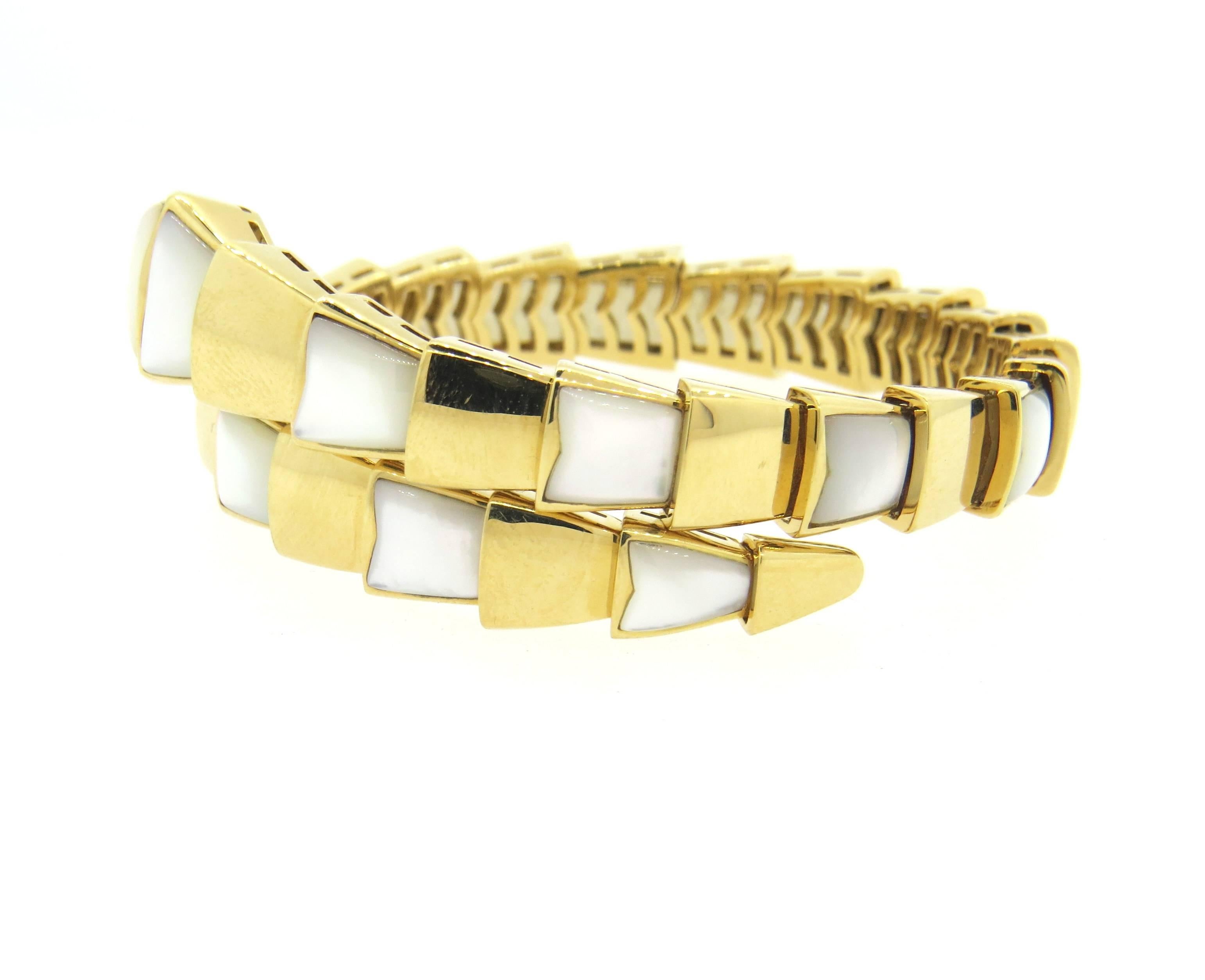 New impressive 18k yellow gold wrap snake bracelet, crafted by Bulgari for Serpenti collection, decorated with mother of pearl. Bracelet will fit up to 7
