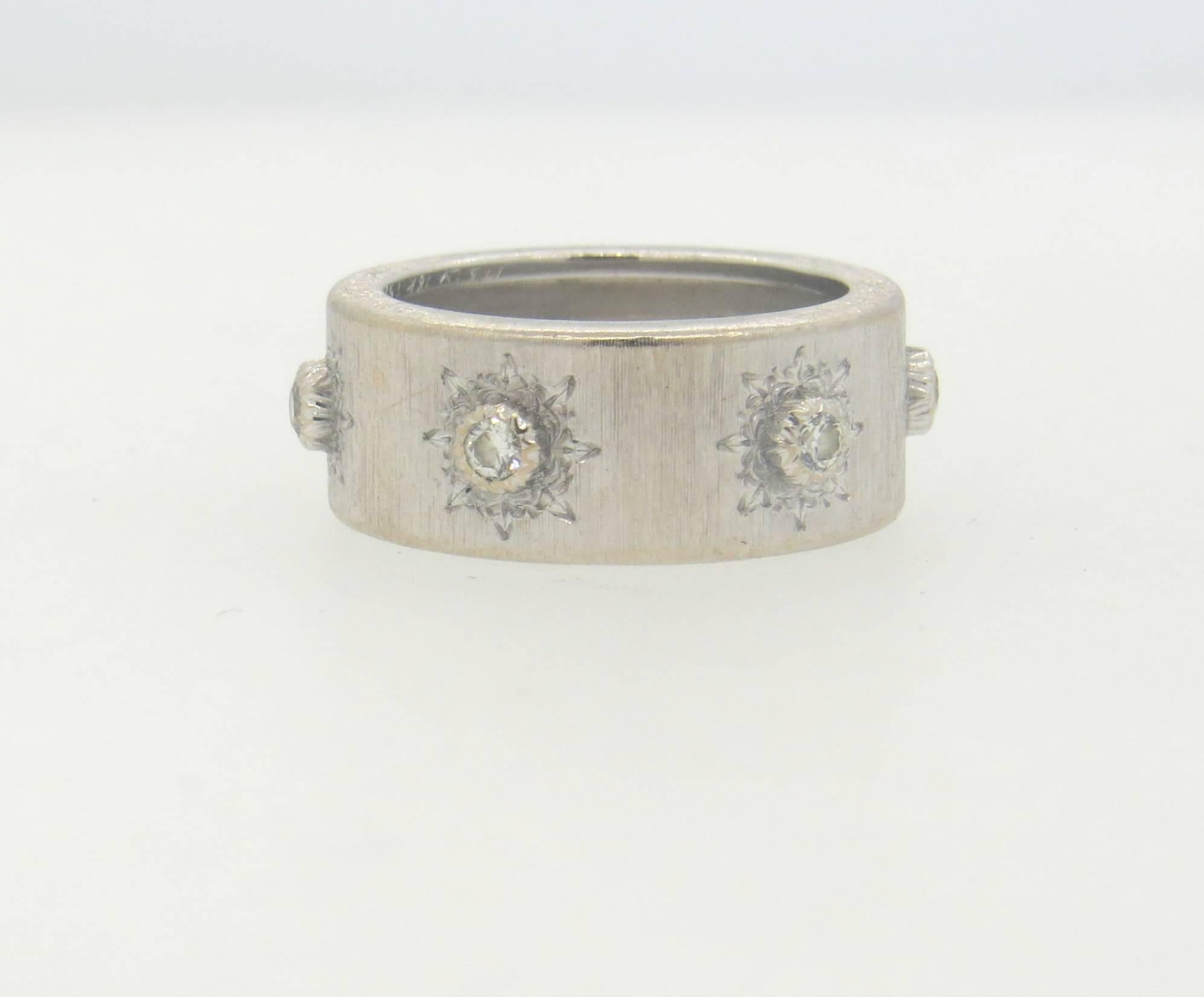 18k white gold wide wedding band ring, crafted by Buccellati, set with six diamonds. Ring is a size 6, ring is 8.5mm wide. Marked 18k, Italy, Buccellati. Weight of the piece - 7.1 grams
Comes with Buccellati box 