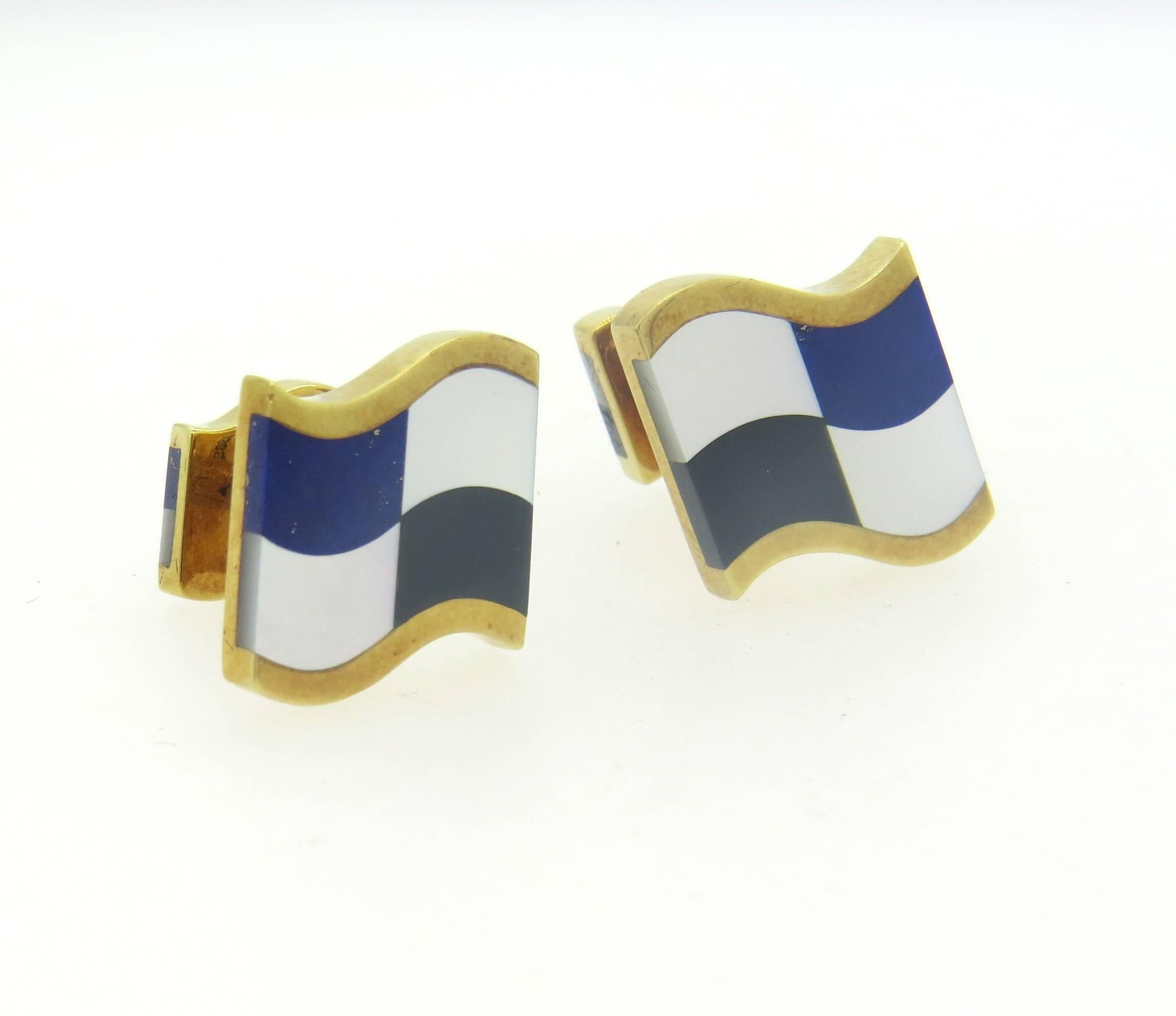 Pair of 18k yellow gold cufflinks, crafted by Tiffany 7 Co in circa 1989, featuring inlay mother of pearl, onyx and lapis lazuli. Top measures 16mm x 16mm. Marked 1989, T & Co, 18k. Weight - 12.4 grams
Come with Tiffany & Co box.
