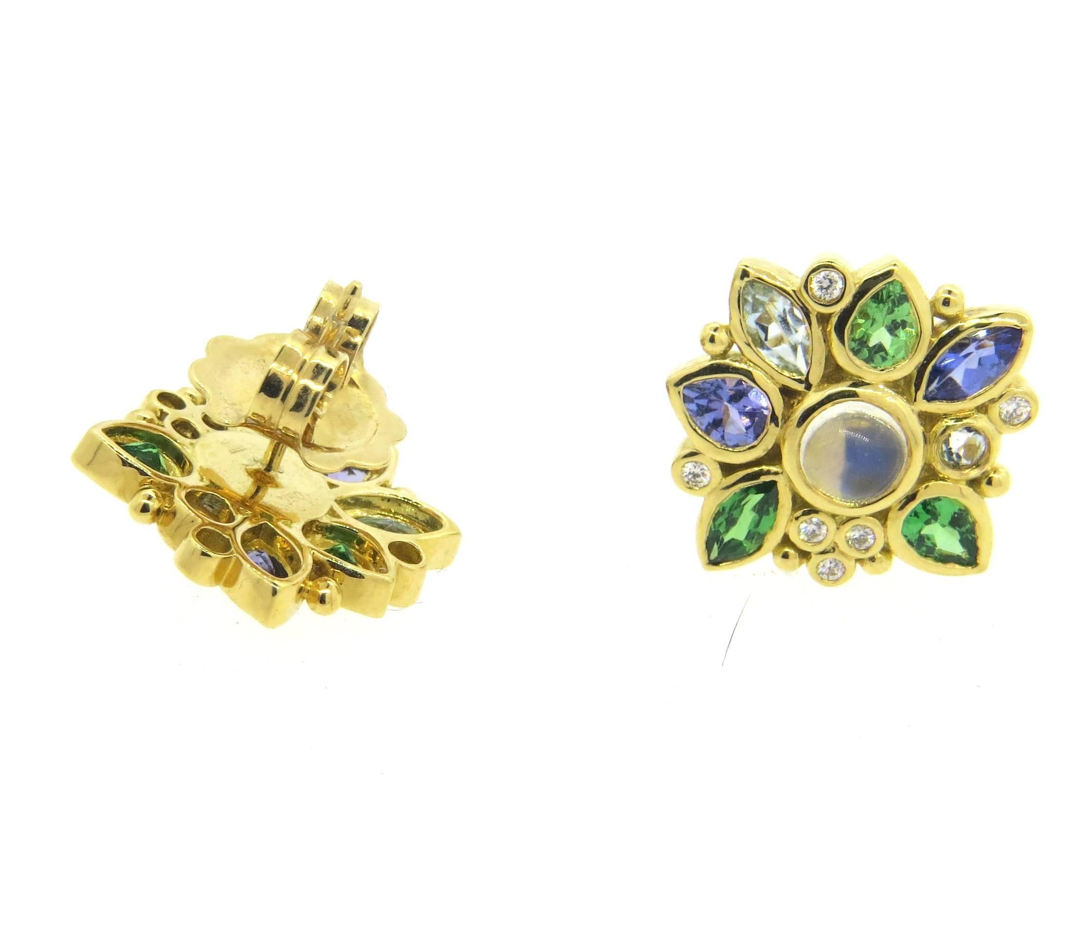 Pair of new 18k yellow gold earrings, crafted by Temple St. Clair for Anima collection, decorated with 0.13ctw in G/VS diamonds, moonstone, tsavorite garnets and tanzanites. Earrings measure 20mm x 19mm. Marked 750 and with Temple hallmark. Weight -