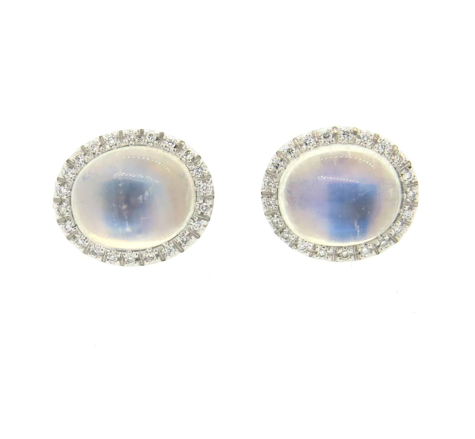 Pair of Favero 18k white gold cufflinks, featuring moonstone cabochons, surrounded with 0.21ctw G/VS diamonds. Each top measures 16mm x 13mm. Marked with maker's mark and 750. Weight - 15 grams
