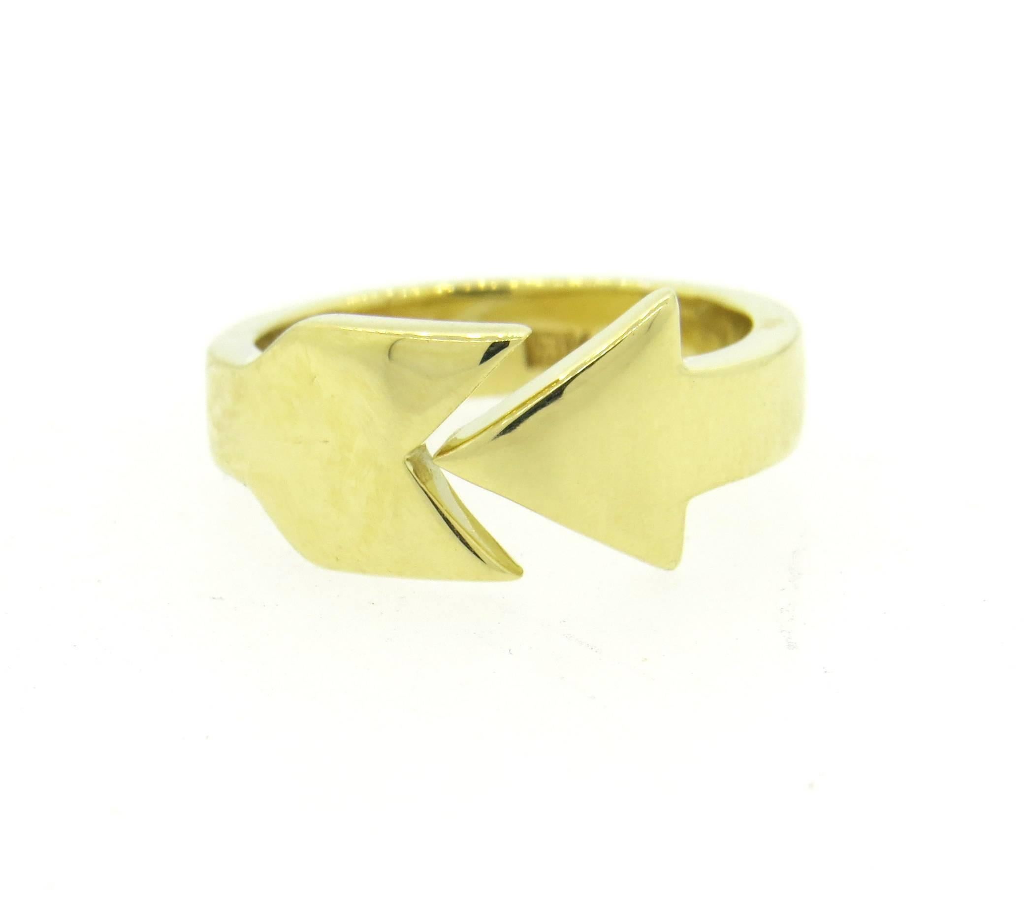 18k yellow gold Cartier ring, featuring arrow design. Ring is a size 5, ring top is 8.3mm at widest point. Marked: Cartier, 18k. Weight - 6.9 grams 