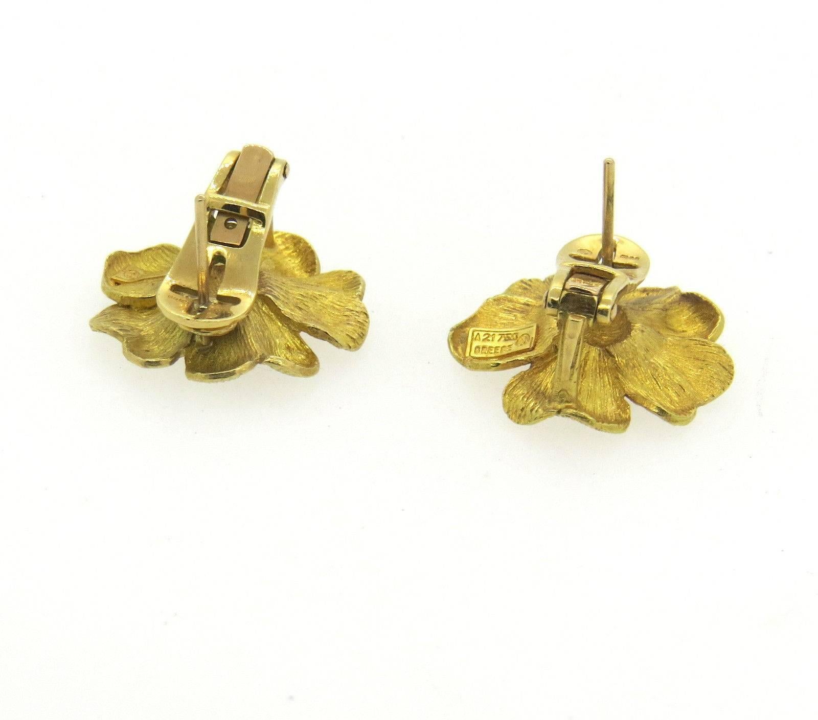 A pair of 18k gold earrings in a flower motif.  Crafted by Ilias Lalaounis, the earrings measure 21mm x 24mm and weigh 13.7 grams.  Marked: A21, 750, Greece, Makers mark 