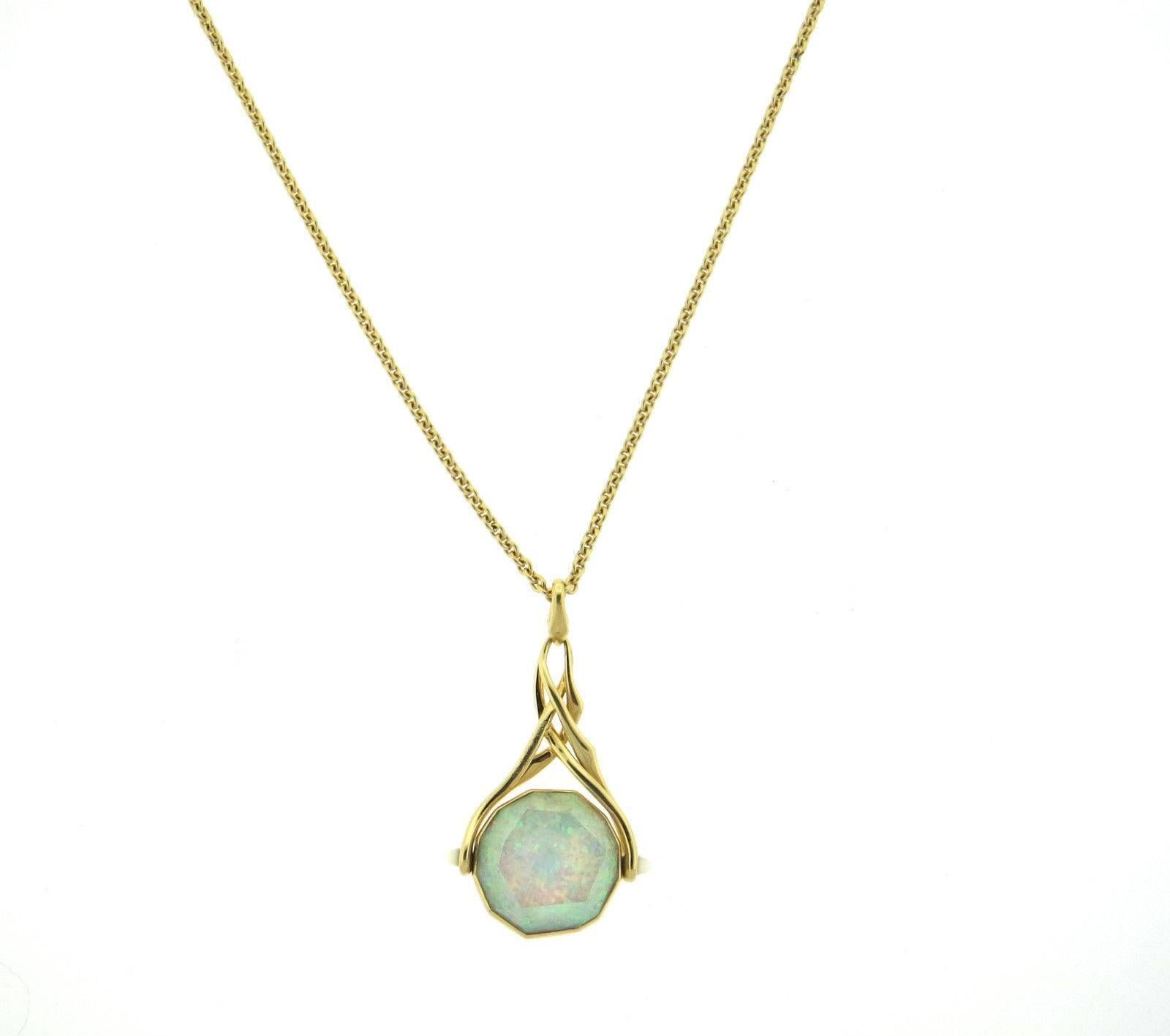 An 18k yellow gold necklace set with opal, mother of pearl and quartz.  Crafted by Stephen Webster, the necklace is 18