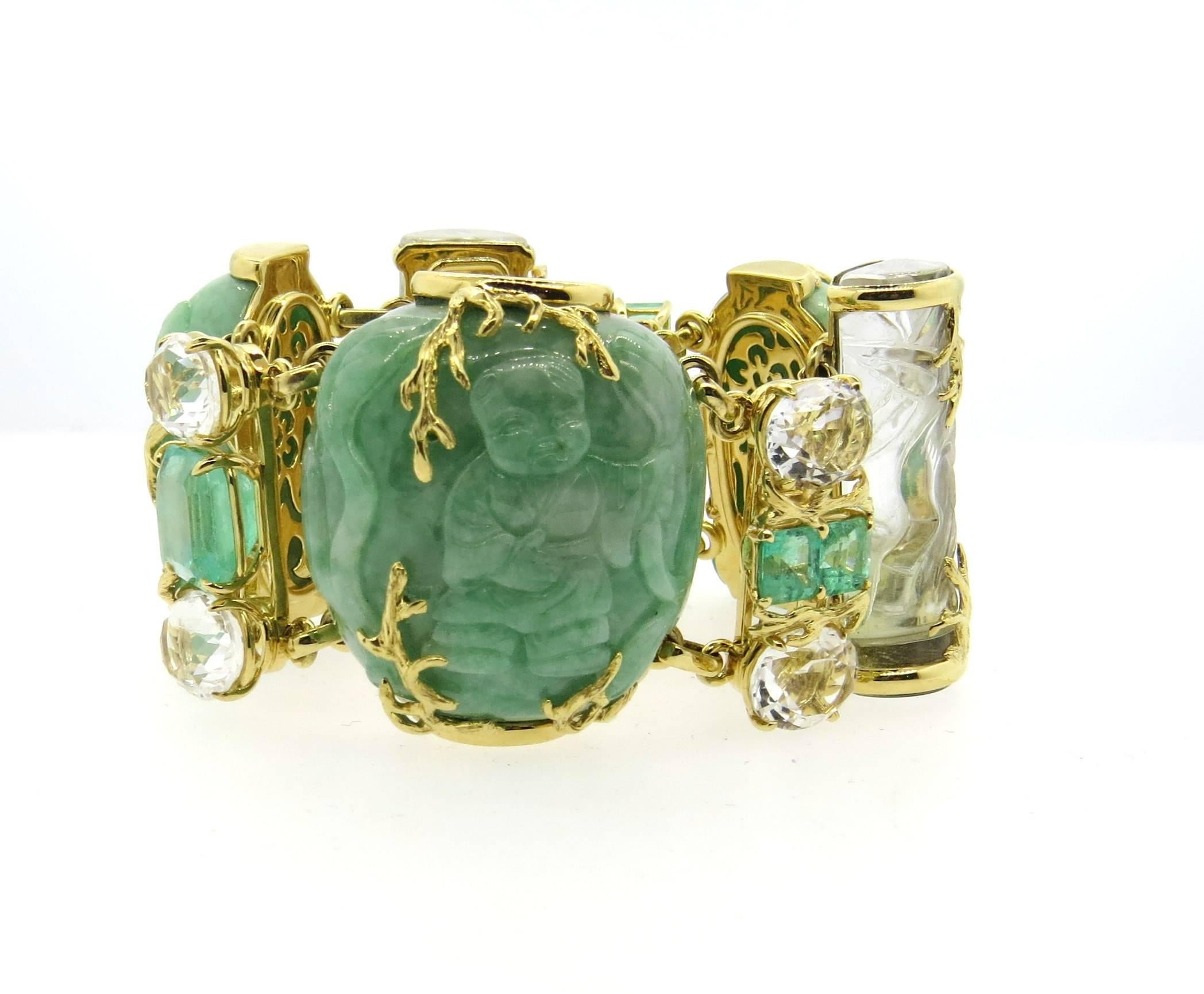 Massive and important 18k yellow gold bracelet, crafted by Seaman Schepps, featuring carved jadeite, emeralds and carved rock crystals. Bracelet is 7 1/8