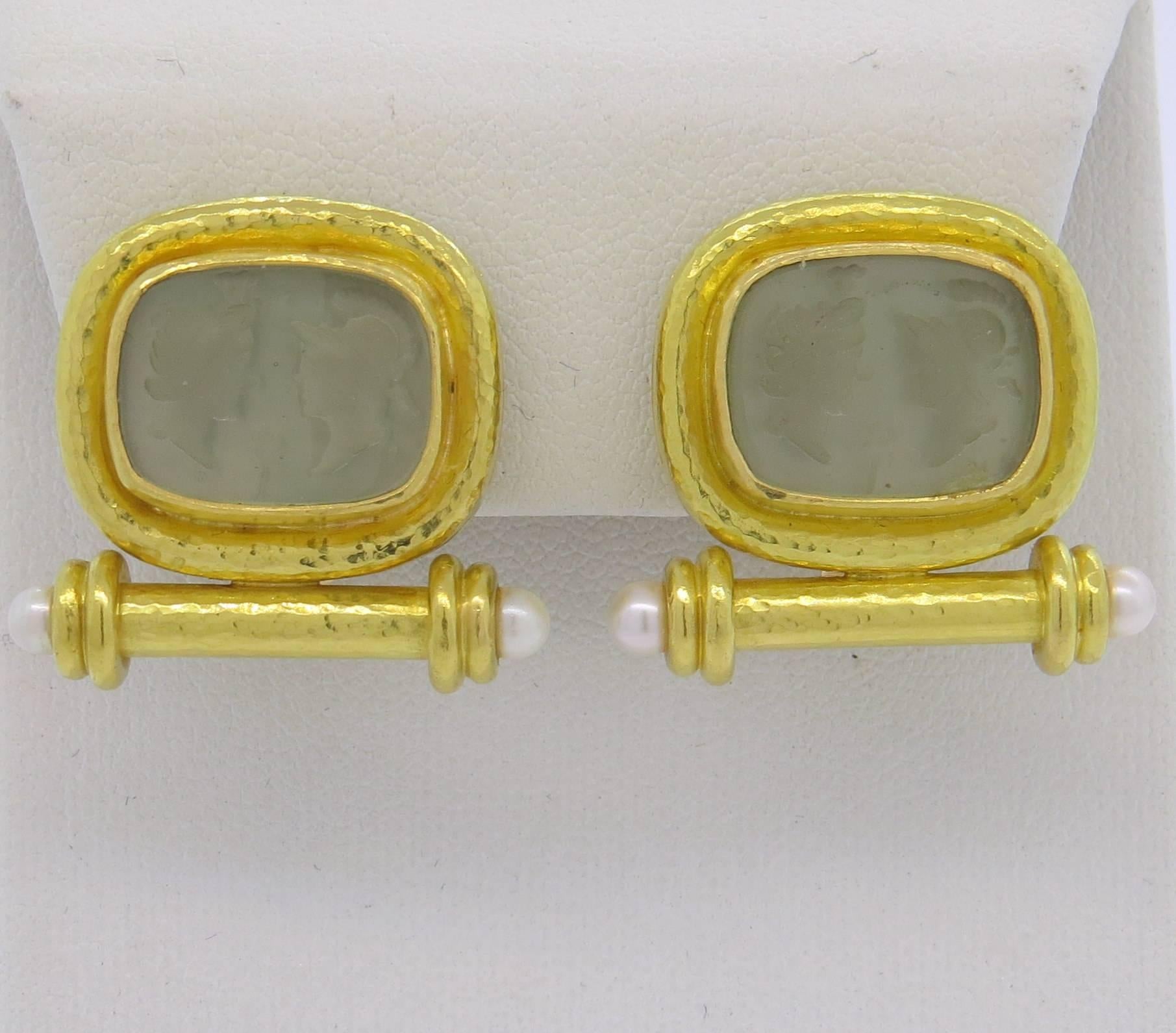 A pair of 18k yellow gold earrings, crafted by Elizabeth Locke, decorated with Venetian glass intaglio, backed with mother of pearl, each set with two pearls. Earrings measure 22mm x 26mm, have collapsible posts. Marked with Locke hallmark and 18k.