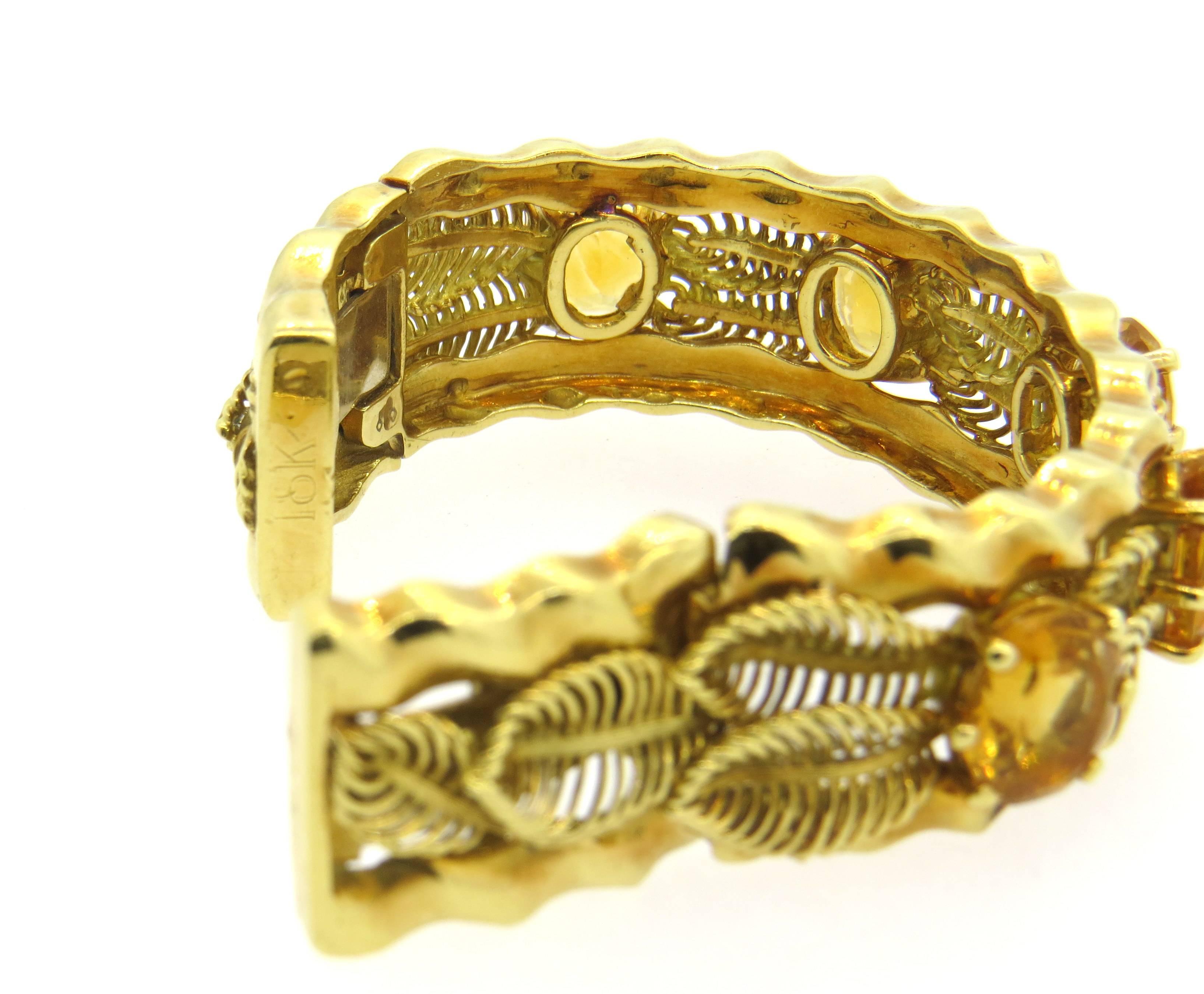 Fine 18k yellow gold leaf motif cuff, crafted with five oval citrine gemstones. Bracelet will fit up to 6 1/2