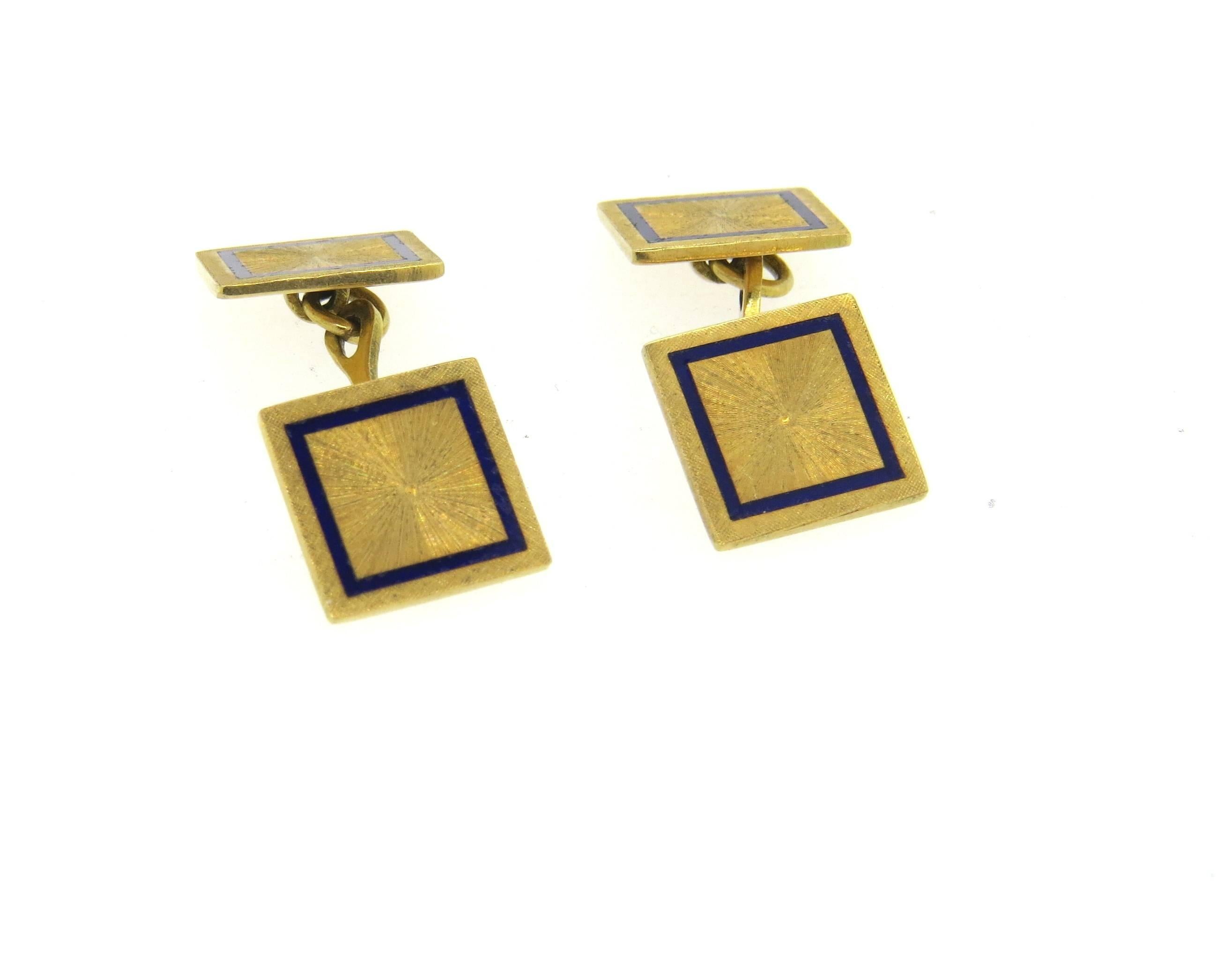 18k yellow gold cufflinks, decorated with blue enamel rim. Each top measures 12.5mm x 12.5mm. Marked 750. Weight - 11.5 grams 