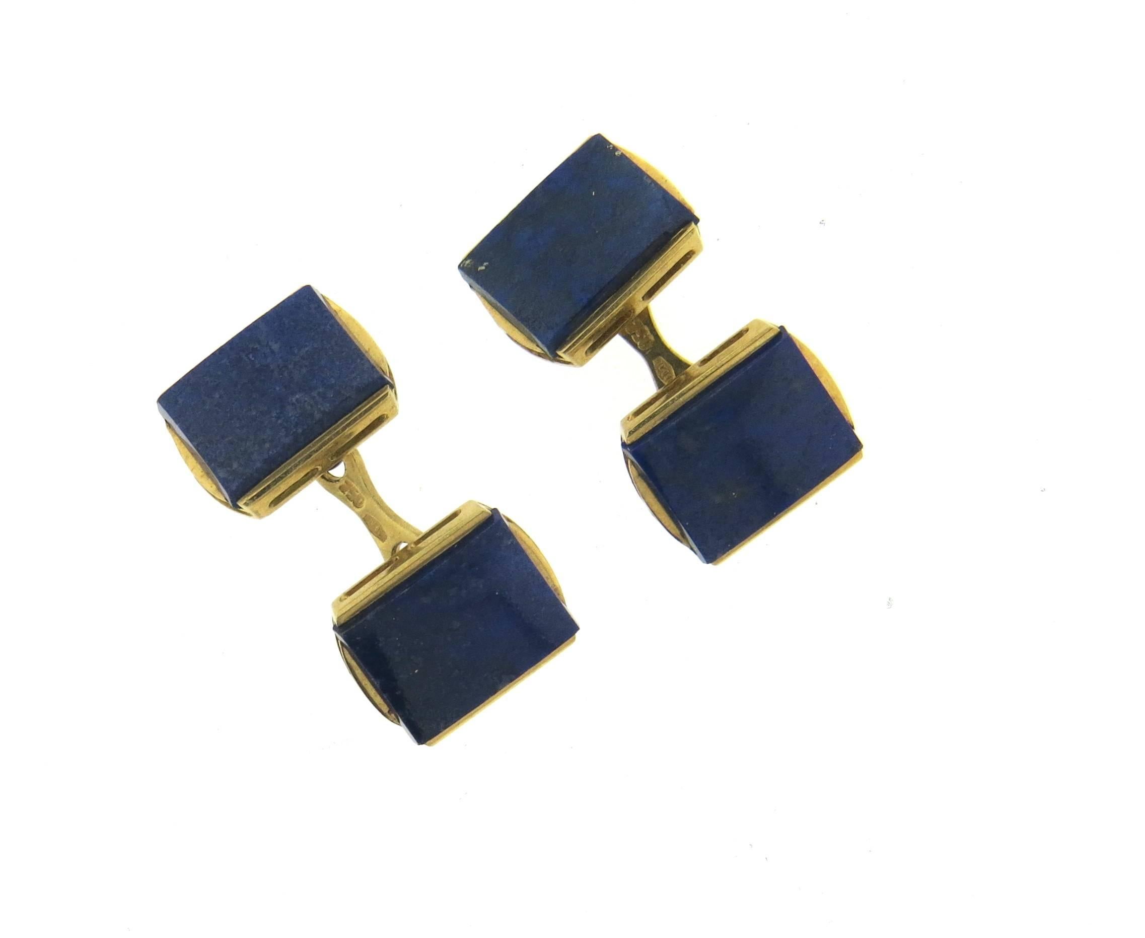 A pair of 18k yellow gold cufflinks, set with lapis lazuli stones. Each top measures 15mm x 11.5mm. Marked 750, 50 AL. Weight - 9.6 grams 