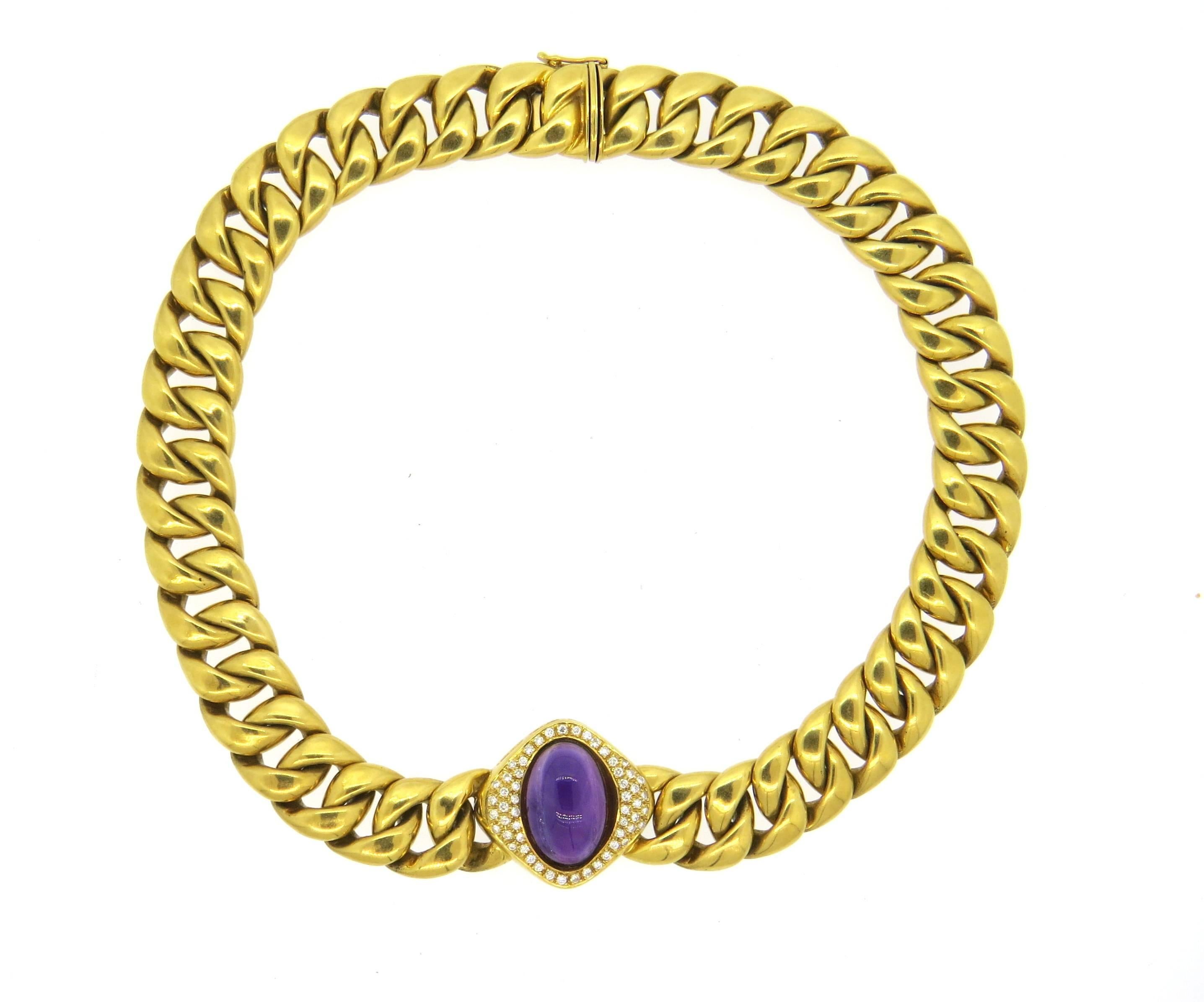Massive 18k yellow gold necklace, featuring link design, set with an approximately 12-15ct amethyst, surrounded with approx. 1.00ctw in GH/VS diamonds. Necklace is 15 3/4