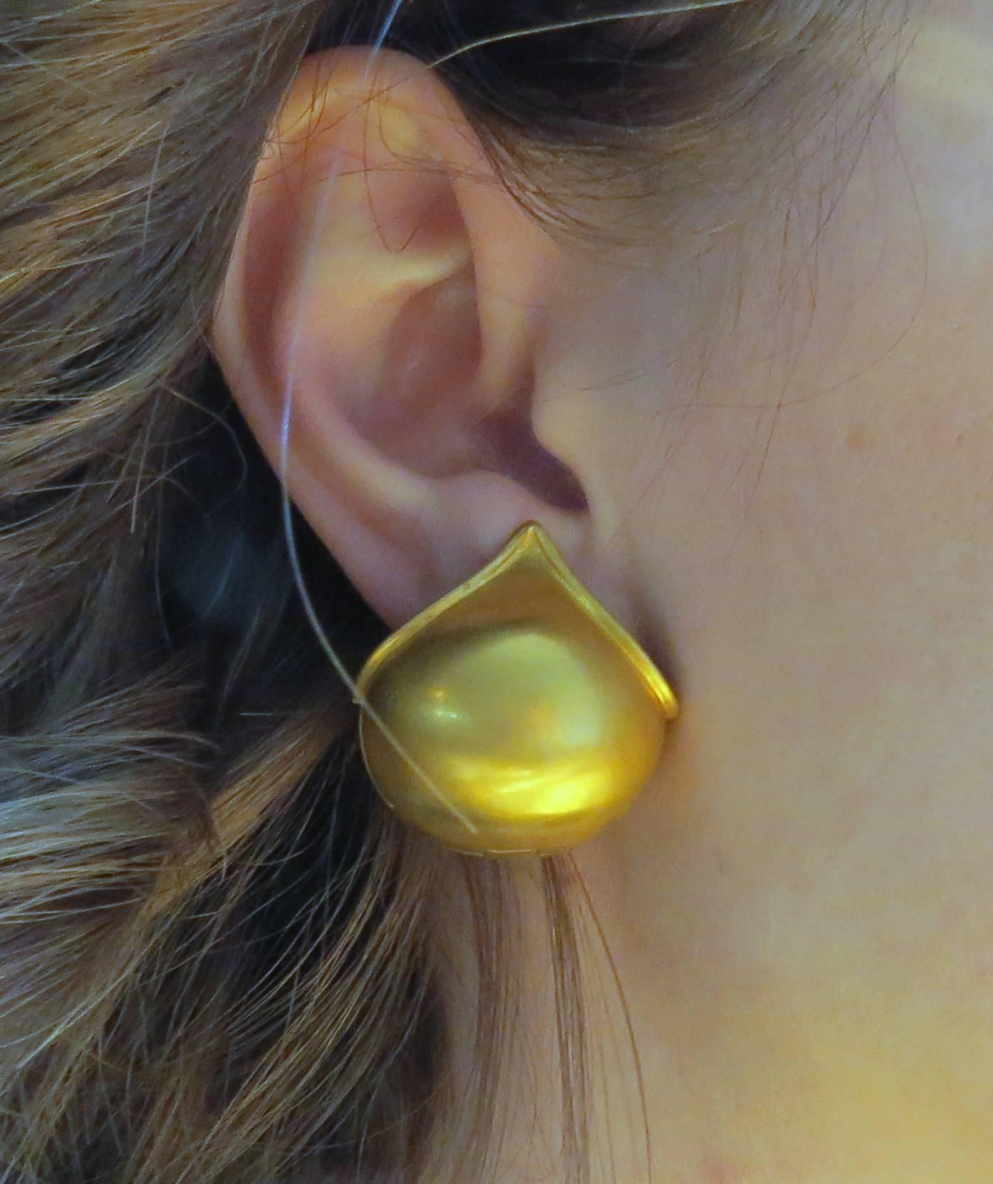 Unusual 18k yellow gold domed huggies. Earrings measure 26mm x 27mm. Weight - 21.1 grams 