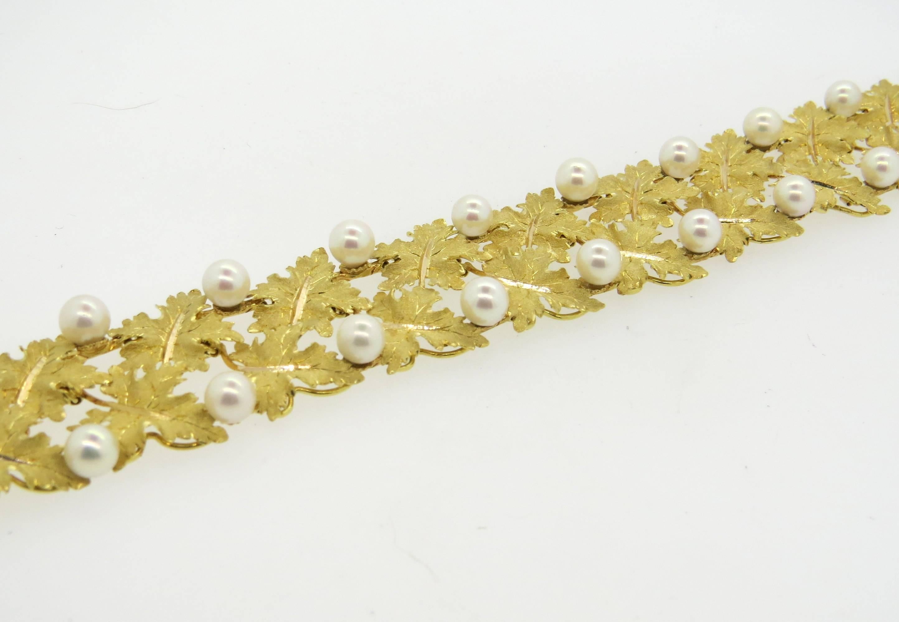 18k yellow gold bracelet, crafted by Buccellati, featuring leaves and 6.5mm pearls. Bracelet is 7 3/8