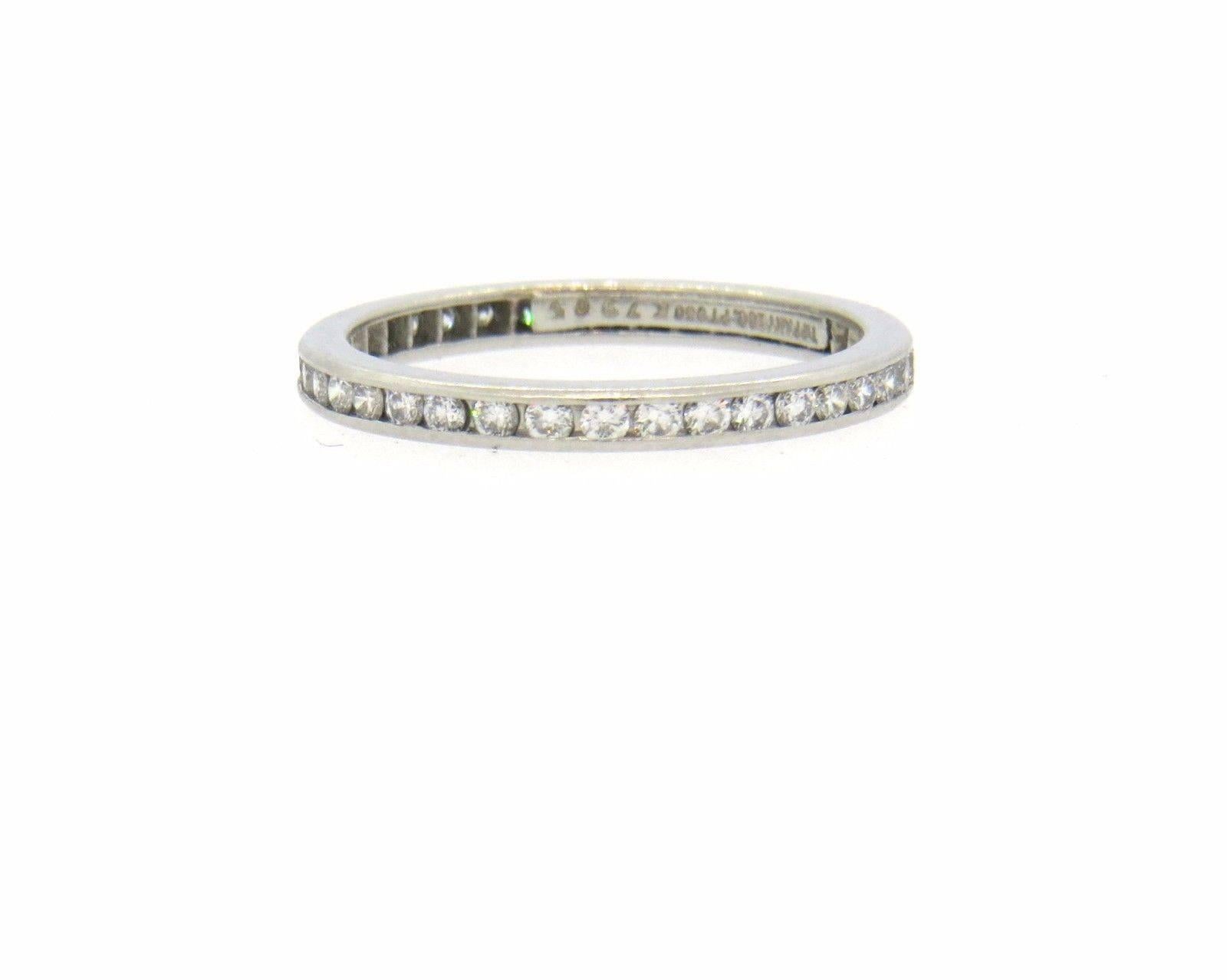 Platinum wedding band ring, crafted by Tiffany & Co for Legacy collection, featuring full circle of approx. 0.40ctw in G/VS diamonds. Ring size 5.5, band is 2mm wide. Marked: Tiffany & Co. PT950. Weight of the piece - 2.4 grams
