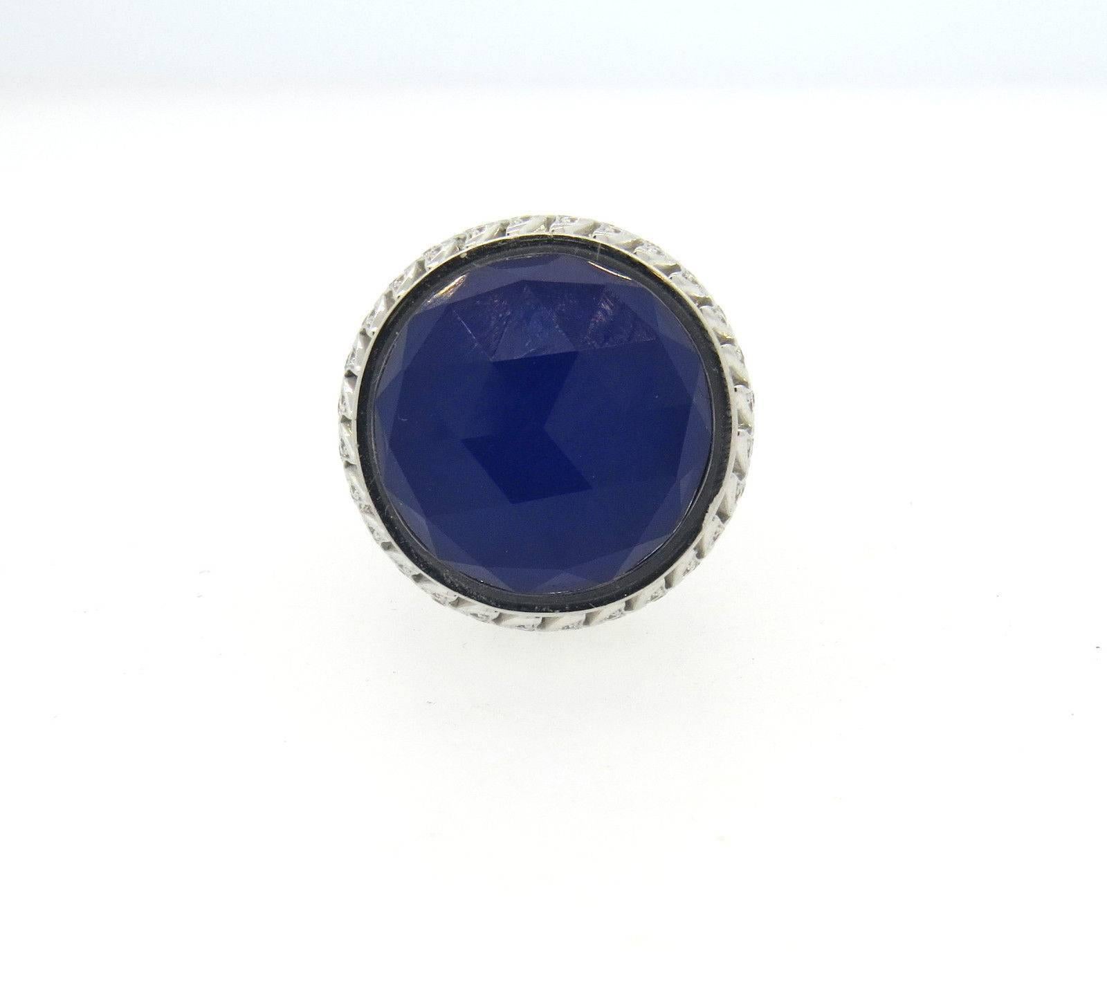 Large new 18k white gold ring, cradted by Stephen Webster, featuring faceted quartz over lapis, surrounded with a1.44ctw in GH/VS diamonds on movable bezel. Ring size 7 1/4, ring top is 26mm in diameter . Marked: SW, English marks, Webster hallmark