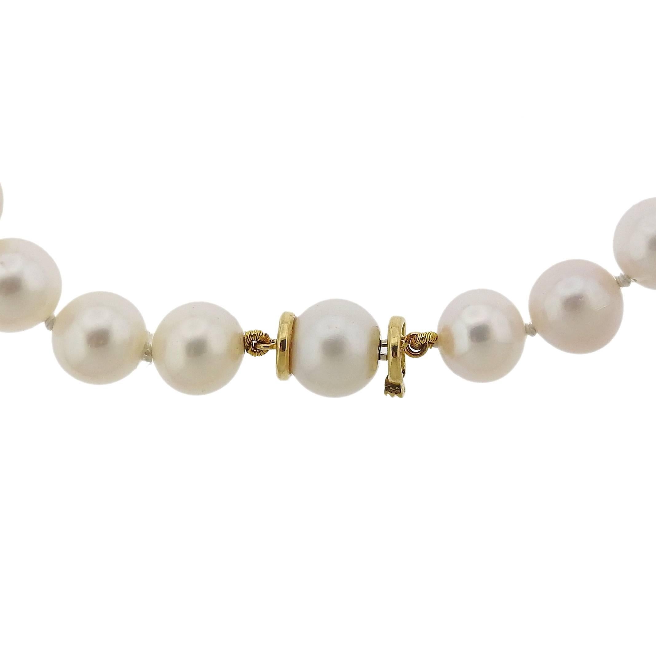 Metal 	18k Yellow And White Gold
Gemstones/diamonds 	57 Pearls Average Approx: 10.4mm In Diameter,
9 Topaz Average Approx From 8.9mm X 13.5mm To 10.7mm X 19.3mm, 4 Leather Spacers Approx: 25mm X 10mm
Measurements 	Necklace 35 5/8