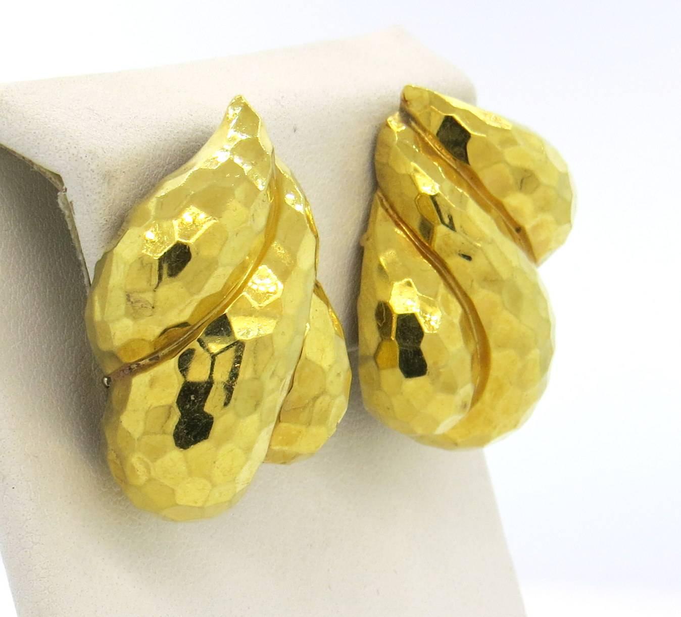 Large pair of 18k hammered yellow gold earrings, crafted by Henry Dunay. Earrings measure 33mm x 25mm. Marked: Dunay, 18k, 63197. Weight - 33.6 grams 