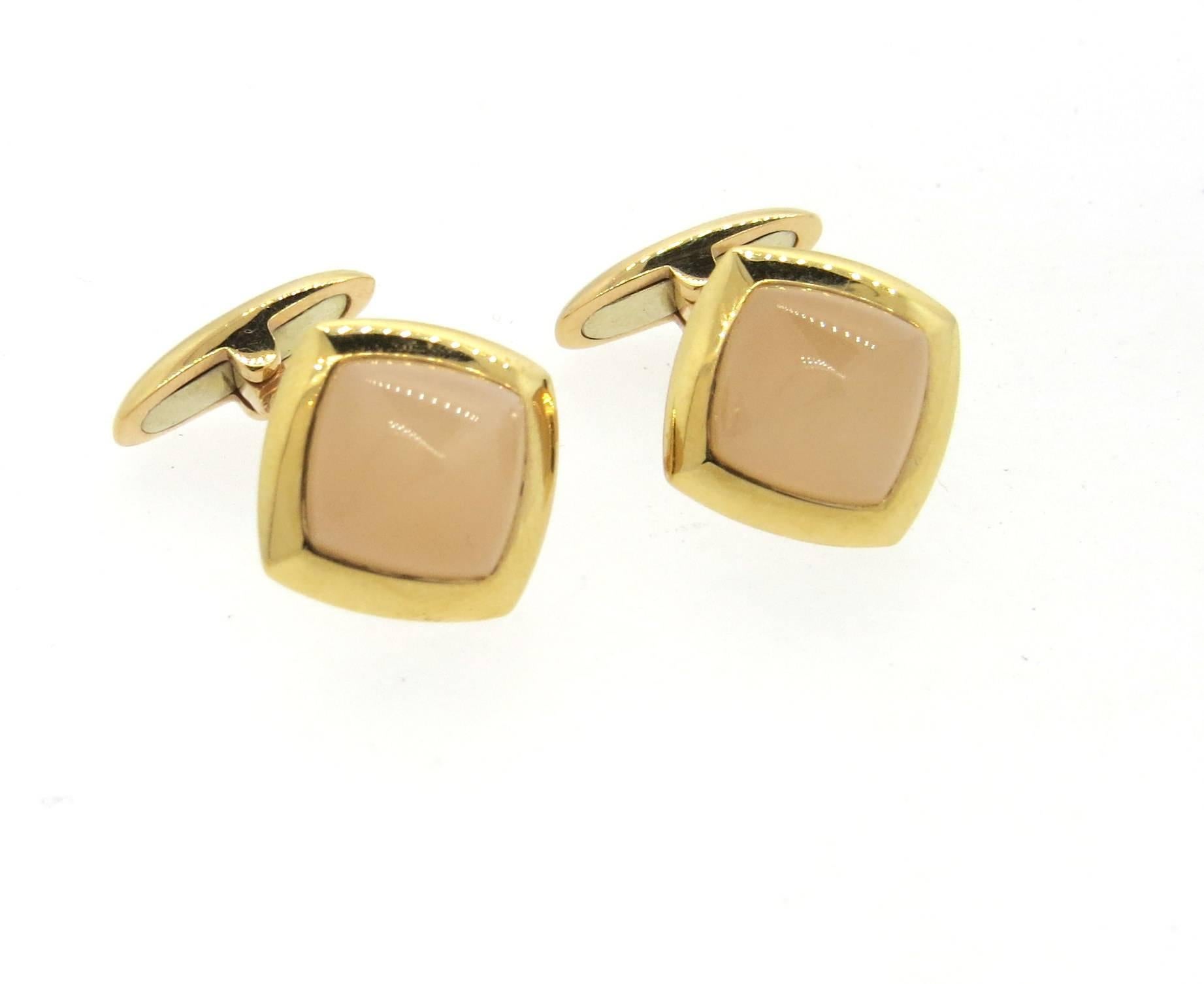 A pair of 18k rose gold cufflinks, crafted by Valente, set with milky pink gemstones. Each top measures 15mm 15mm. Marked Valente, 750. Weight - 12.2 grams 