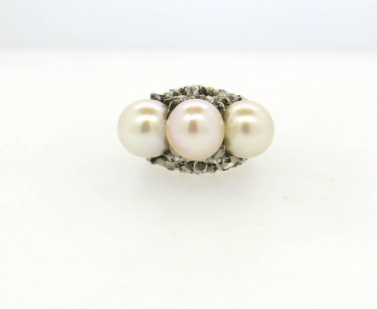 Impressive 18k gold ring, crafted by Buccellati, featuring three South Sea pearls - 10mm and 10.3mm in diameter, surrounded with rose cut diamonds. Ring is a size 6, ring top is 14mm x 25mm, sits approx. 19mm from the finger. Marked Gianmaria