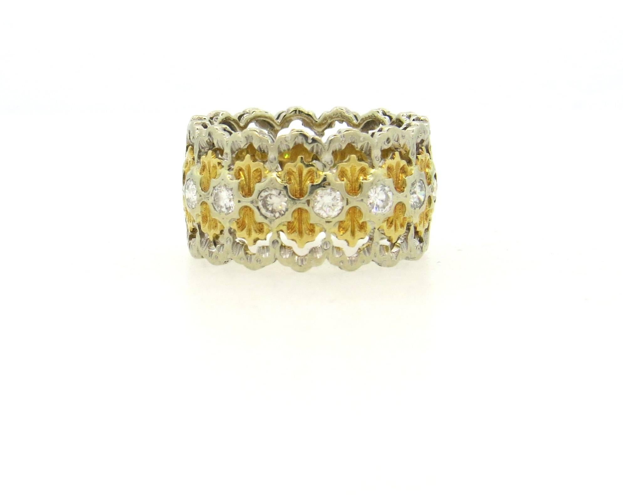 Vintage Buccellati band ring, set in 18k white and yellow gold, featuring approximately 0.56ctw in H/VS diamonds. Ring is a size 6 1/2, ring is 12mm wide.  Marked: Buccellati. Weight of the piece - 7.8 grams 