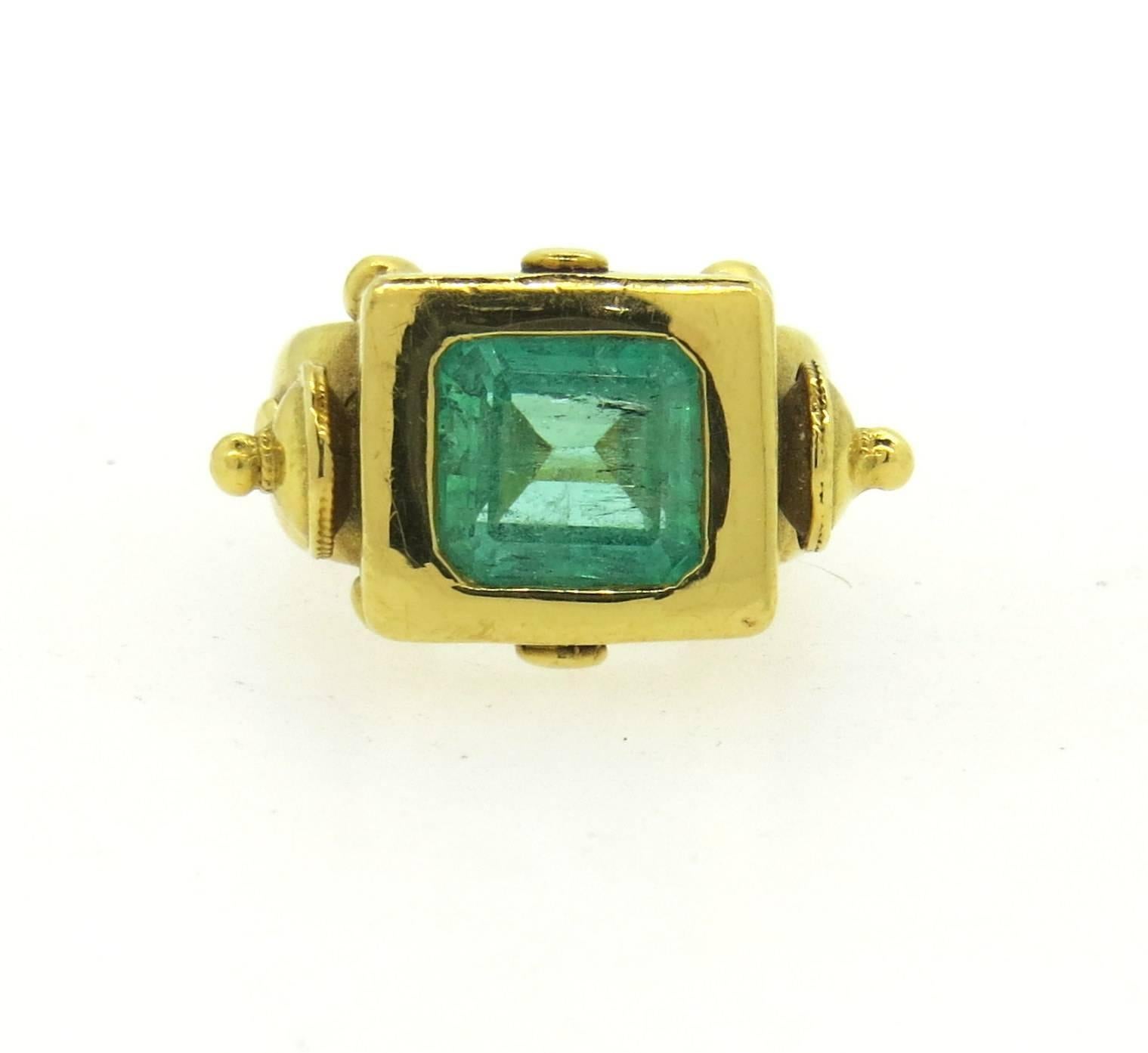 Large 18k yellow gold ring, crafted by Laurence DeVries, set with and approximately 3.85ct emerald as a centerpiece. Ring is a size 5 1/4, ring top measures 15mm x 25mm. Marked De Vries. Weight of the piece - 29.6 grams 