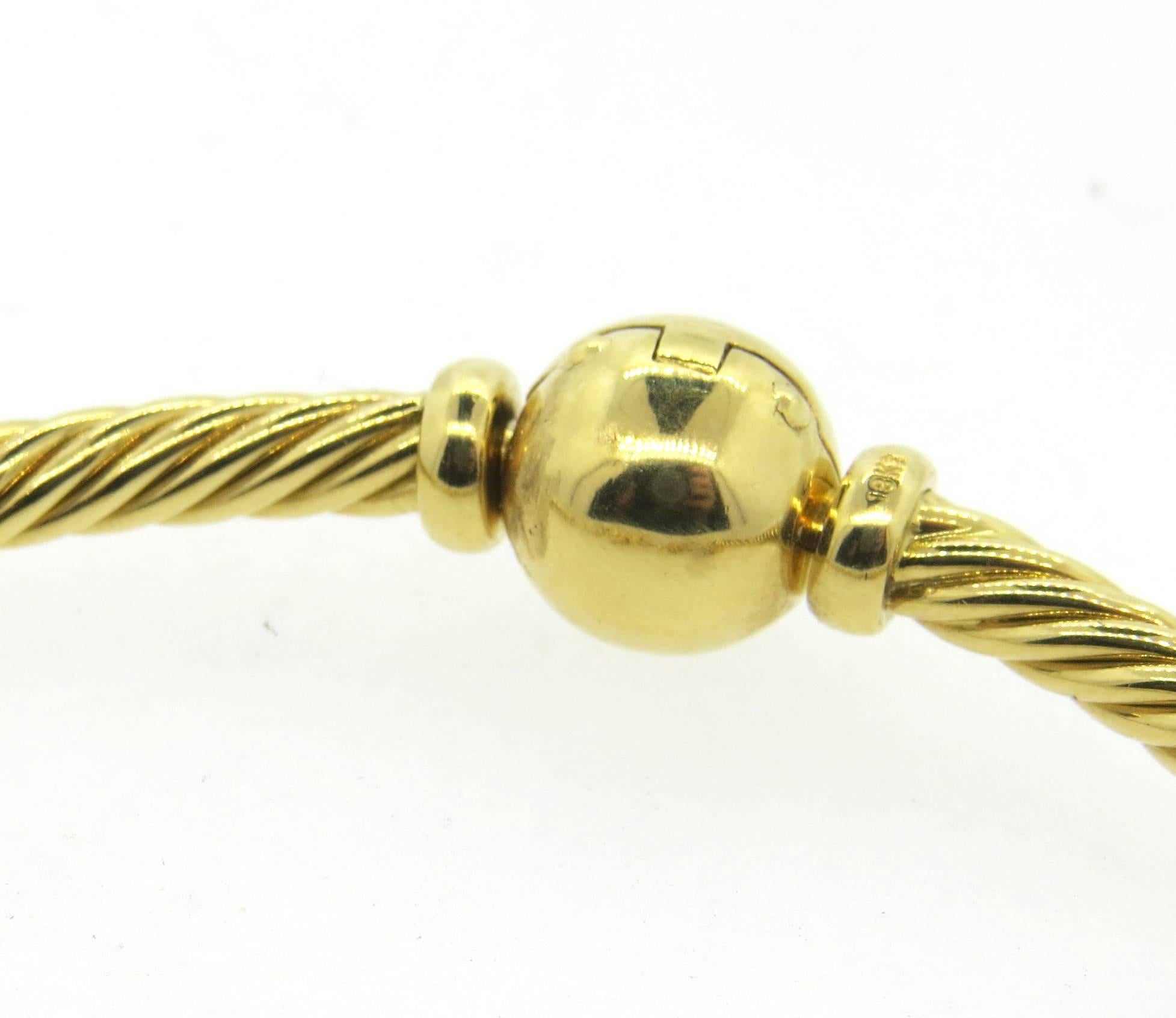 18k yellow gold bracelet, crafted by Pomellato, featuring five Orsetto charms. Bracelet is 6 1/2