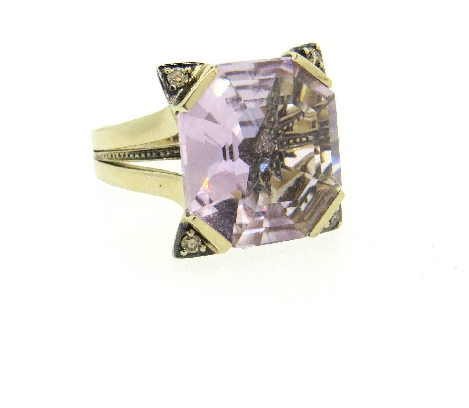 An 18k yellow gold ring set with purple quartz and approx. 0.04ctw of diamonds.  The ring size 5 1/2, ring top is 17.6mm x 16.6mm. Marked: S mark, Star, 750.  Weight of the ring is 12.8 grams.