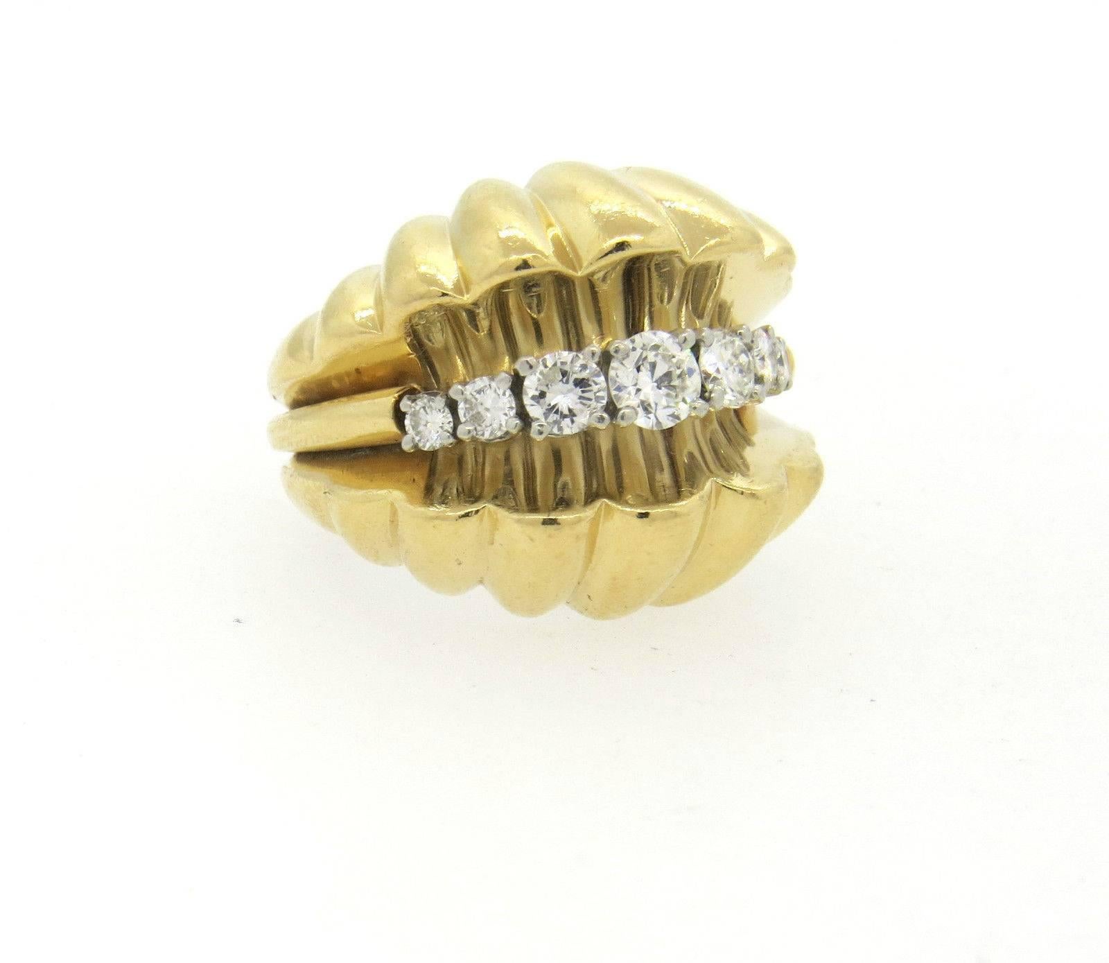 A 14k yellow gold ring set with approximately 1.00ctw of H/ VS-SI diamonds.  Depicting an open shell, the ring is a size 5, the ring top is 23mm wide.  The weight of the ring is 29.3 grams.