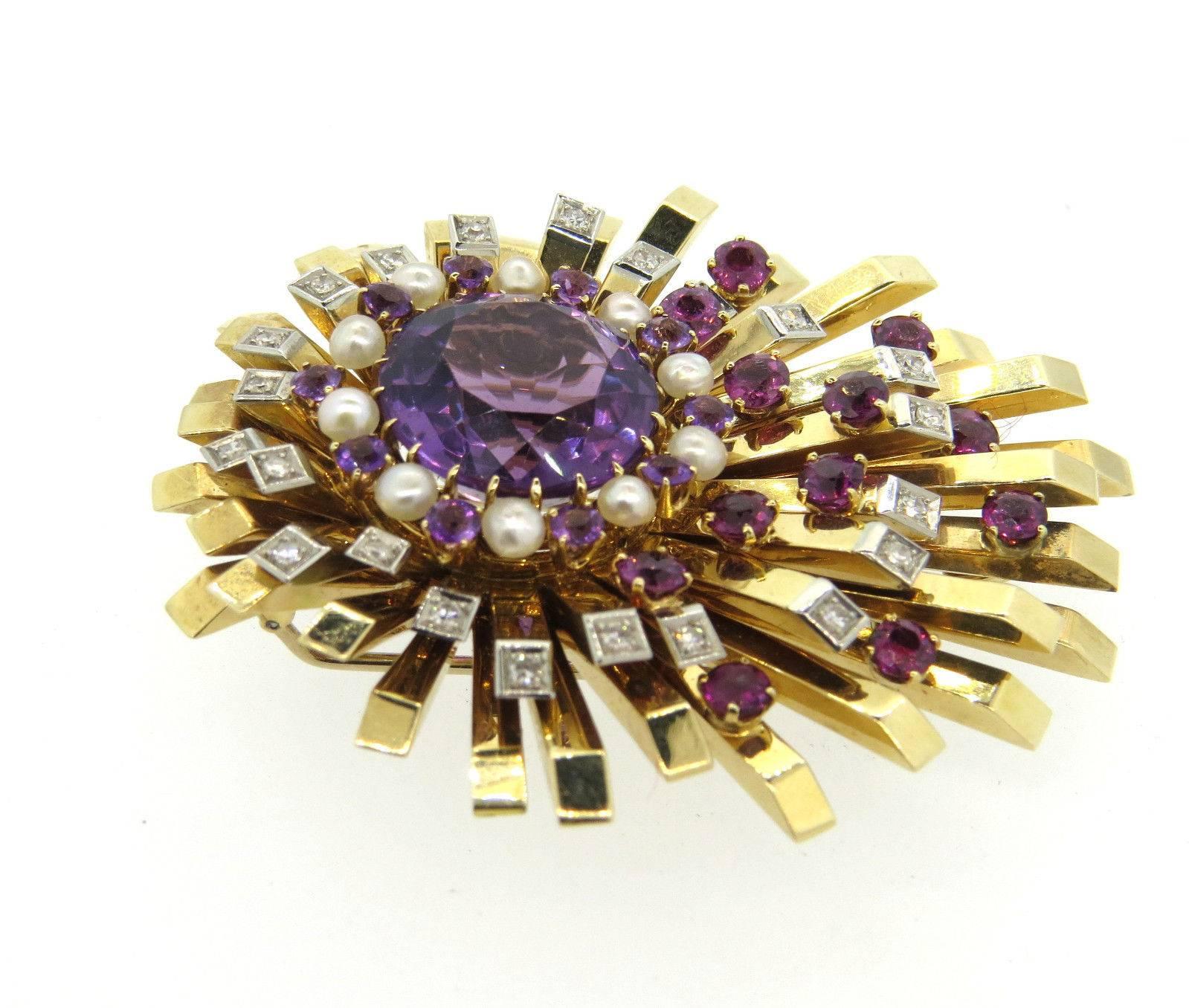 A 14k yellow gold brooch set with approx. 0.50ctw of HI/VS diamonds and pearls amethyst and pink tourmalines. The brooch measures 60mm x 53mm and weighs 43.8 grams.
