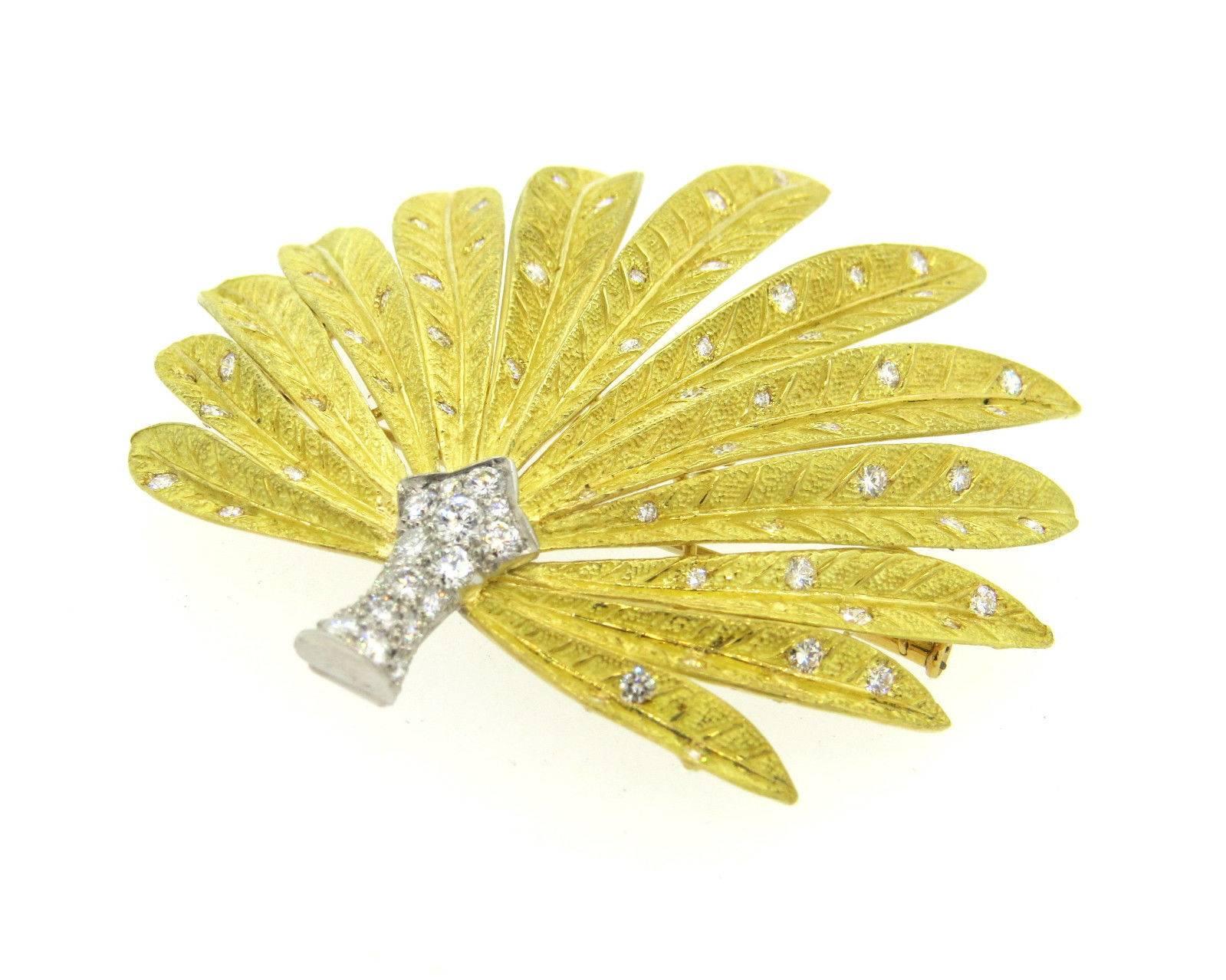 An 18k yellow gold and platinum flower brooch set with approx. 2.00ctw of G/VS diamonds. The brooch measures 64mm x 62mm and weighs 40.1 grams.