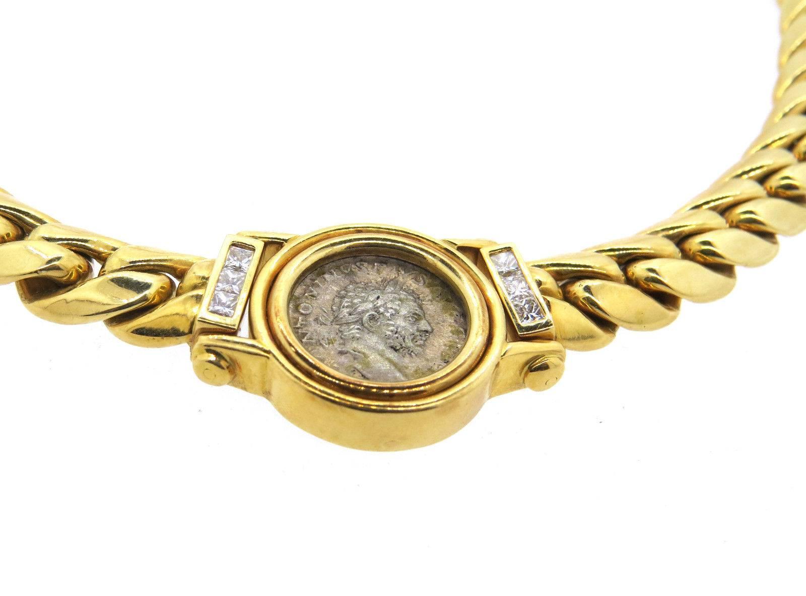 An 18k yellow gold necklace set with a coin 16mm in diameter and approximately 0.90ctw of G/VS princess cut diamonds. Crafted by Weingrill, the necklace is 17