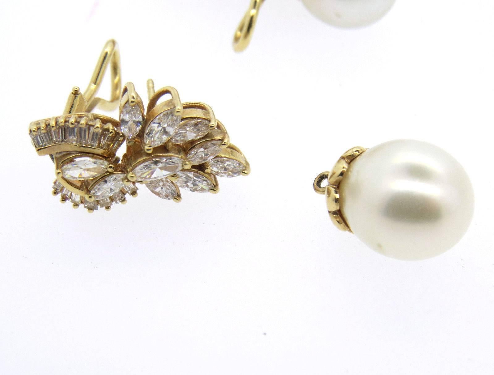 A pair of 14k yellow gold day/night earrings with 11.8mm south sea pearl drops and approximately 2.50ctw of GH/VS diamonds. The earrings measure 38mm x 12mm and weigh 15.9 grams. 
