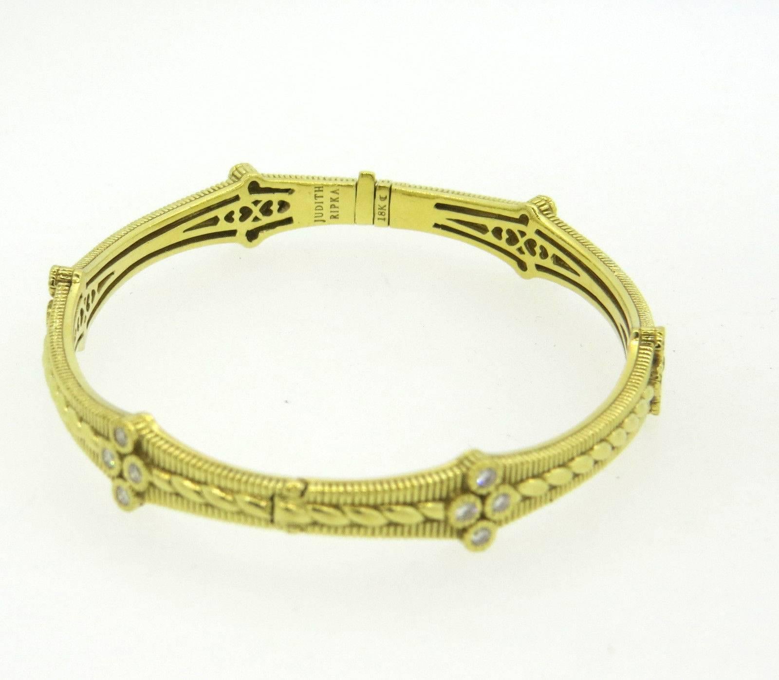 An 18k yellow gold bangle bracelet, set with approx 0.48ctw of GH/VS diamonds. Crafted by Judith Ripka bracelet will fit up to 7