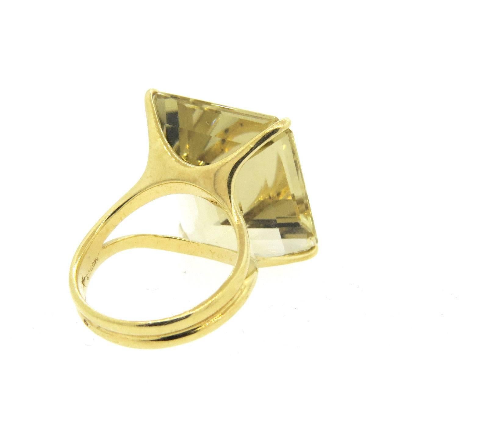 An 18k yellow gold ring set with a quartz measuring 20.2mm x 17.8mm x 9.3mm.  Crafted by H. Stern, the ring is a size 6 1/2.  Marked: Star mark, 750, MG923.  The weight of the ring is 10 grams.