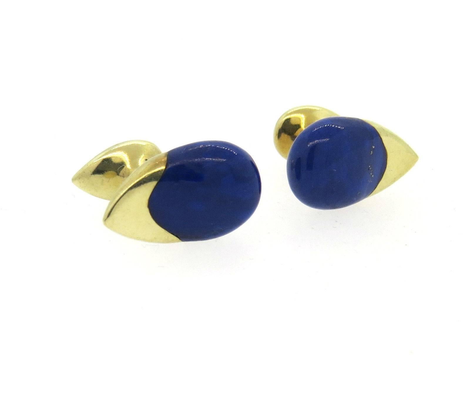 A pair 14k yellow gold cufflinks set with a lapis inlay. Each top measures 21mm x 13mm.  Marked: 14k, 585.  The weight of the cufflinks is 13.3 grams.