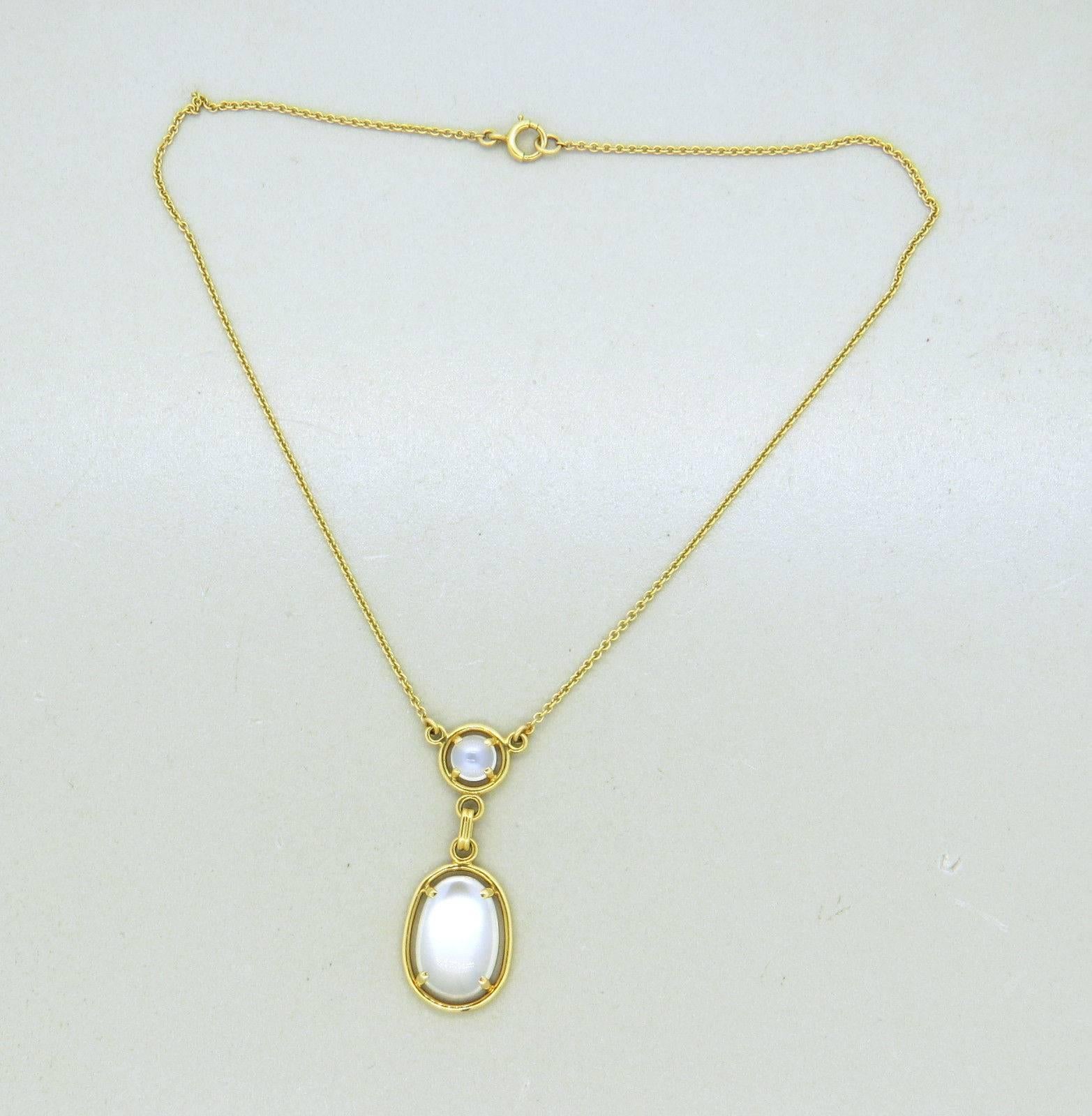 A 14k yellow gold necklace set with Moonstones. The necklace is 13 3/4