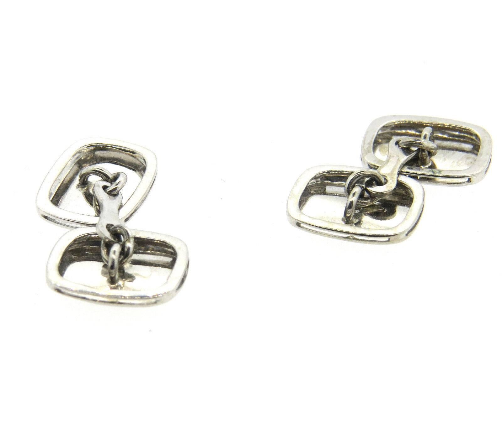 A pair of 18k white gold cufflinks set with 0.04ctw of H/VS diamonds.	 Each top measures 15mm x 12mm.  The weight of the cufflinks is 8.3 grams.