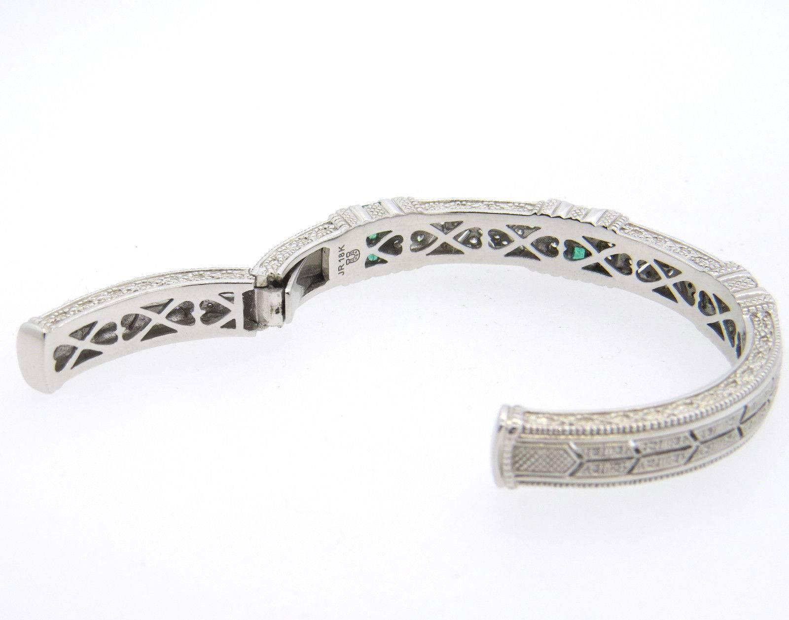 An 18K white gold bracelet set with emeralds and approximately 0.65ctw of H/VS diamonds.  Crafted by Judith Ripka for her Estate collection, the bracelet will fit up to 6 3/4