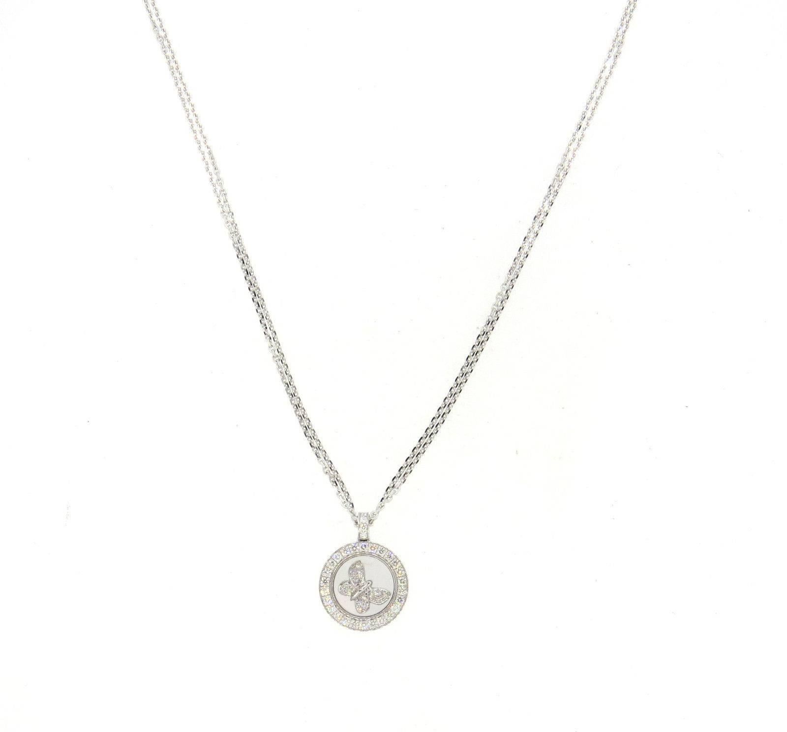 An 18k white gold pendant necklace set with 0.63ctw of F/VVS diamonds.  Crafted by Chopard, the necklace chain is 16 3/4